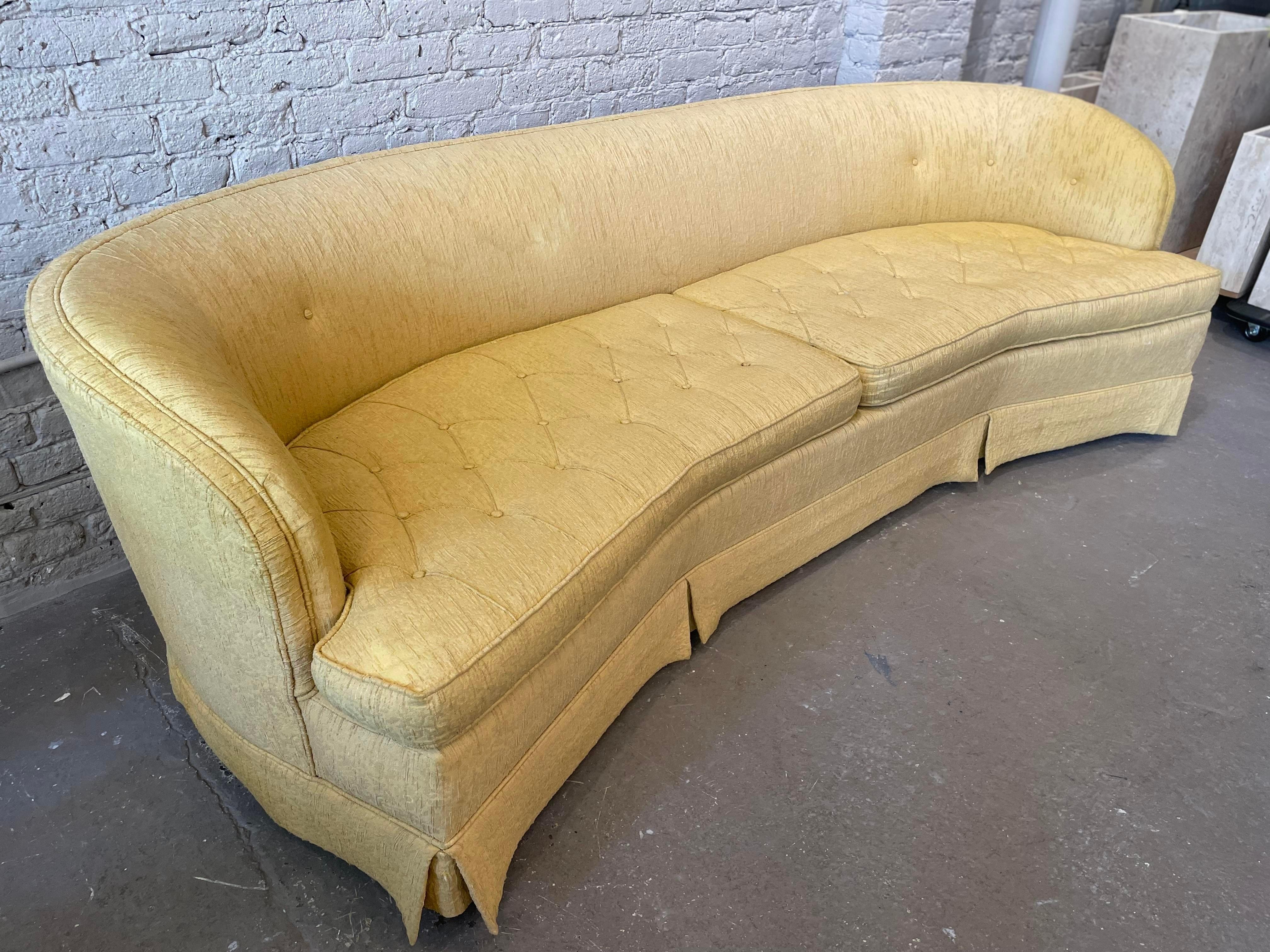 Gorgeous lines and solid construction. Mid Century and made by Berne furniture in Indiana in the same town as Dunbar and many other famous fine craftsman.

Us as is or reupholster. The feet are wood - see picture.