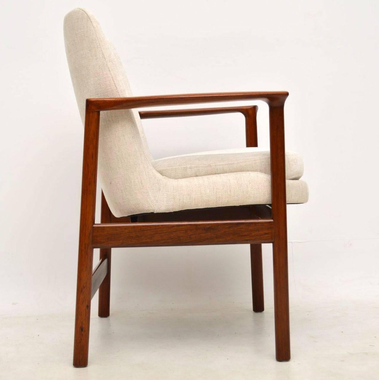 A stunning vintage Danish armchair, this dates from the 1960s. We have had the frame stripped and re-polished to a very high standard, it has a beautiful color tone. We’ve had the seat newly re-upholstered in our off white fabric, the condition of