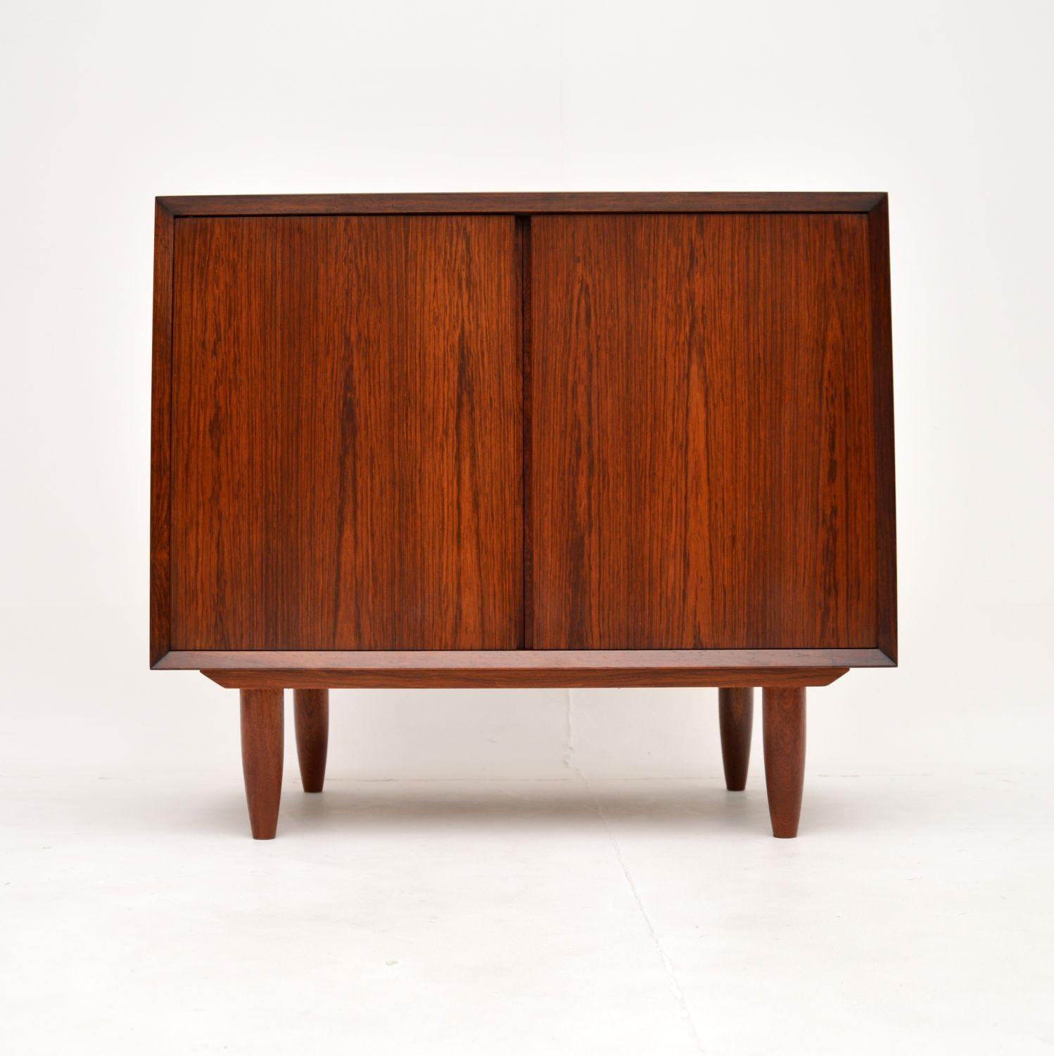 A superb vintage Danish cabinet on legs. This was designed by Poul Cadovius and was made in Denmark by Cado, it dates from the 1960’s.

The quality is outstanding, this is so well made and is a very useful size. The wood has a gorgeous colour and