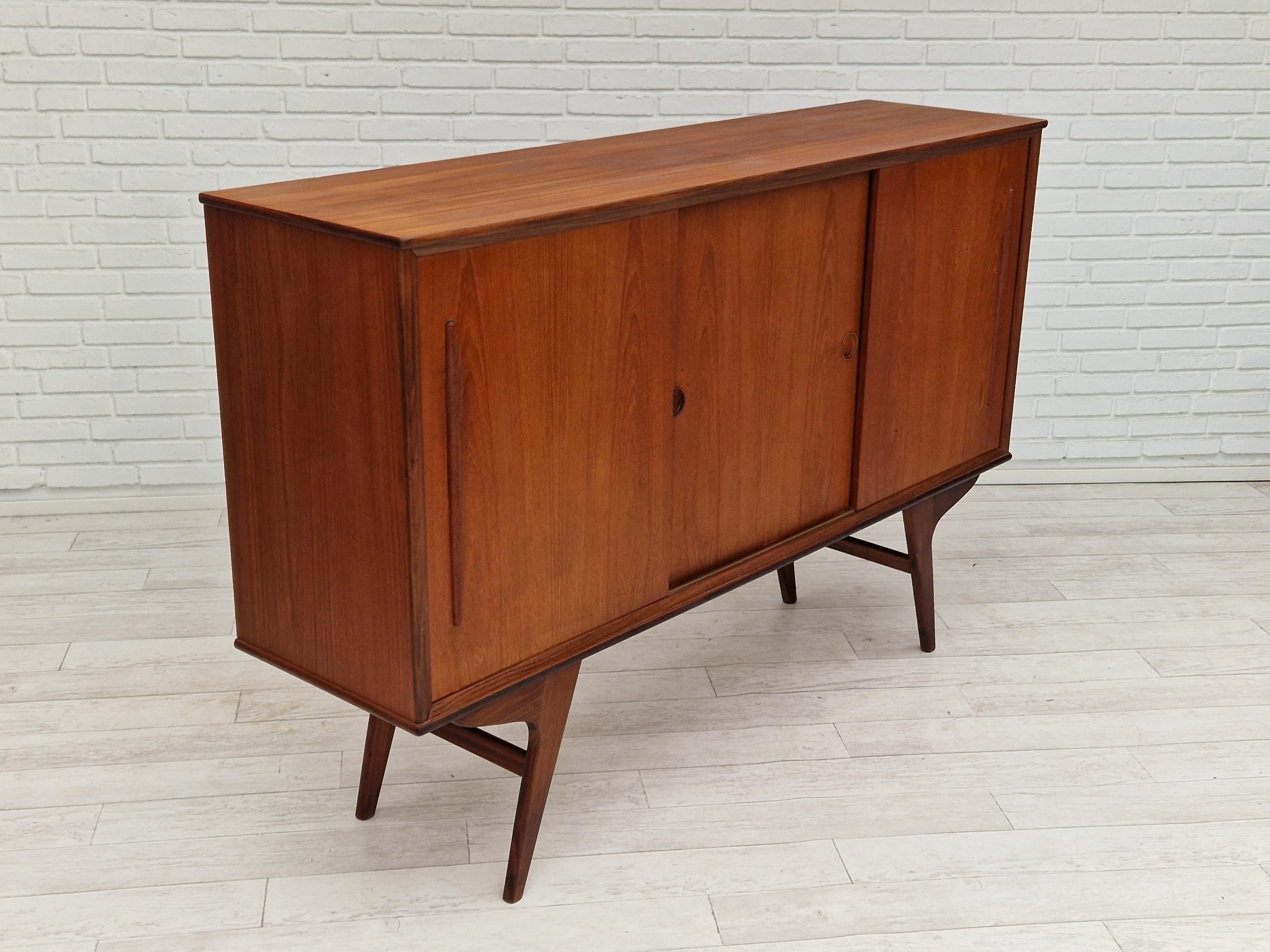 Vintage Danishcabinet-chest, teak wood. Sliding doors, drawers, mirror inside. No smells, no stains. Very good condition.