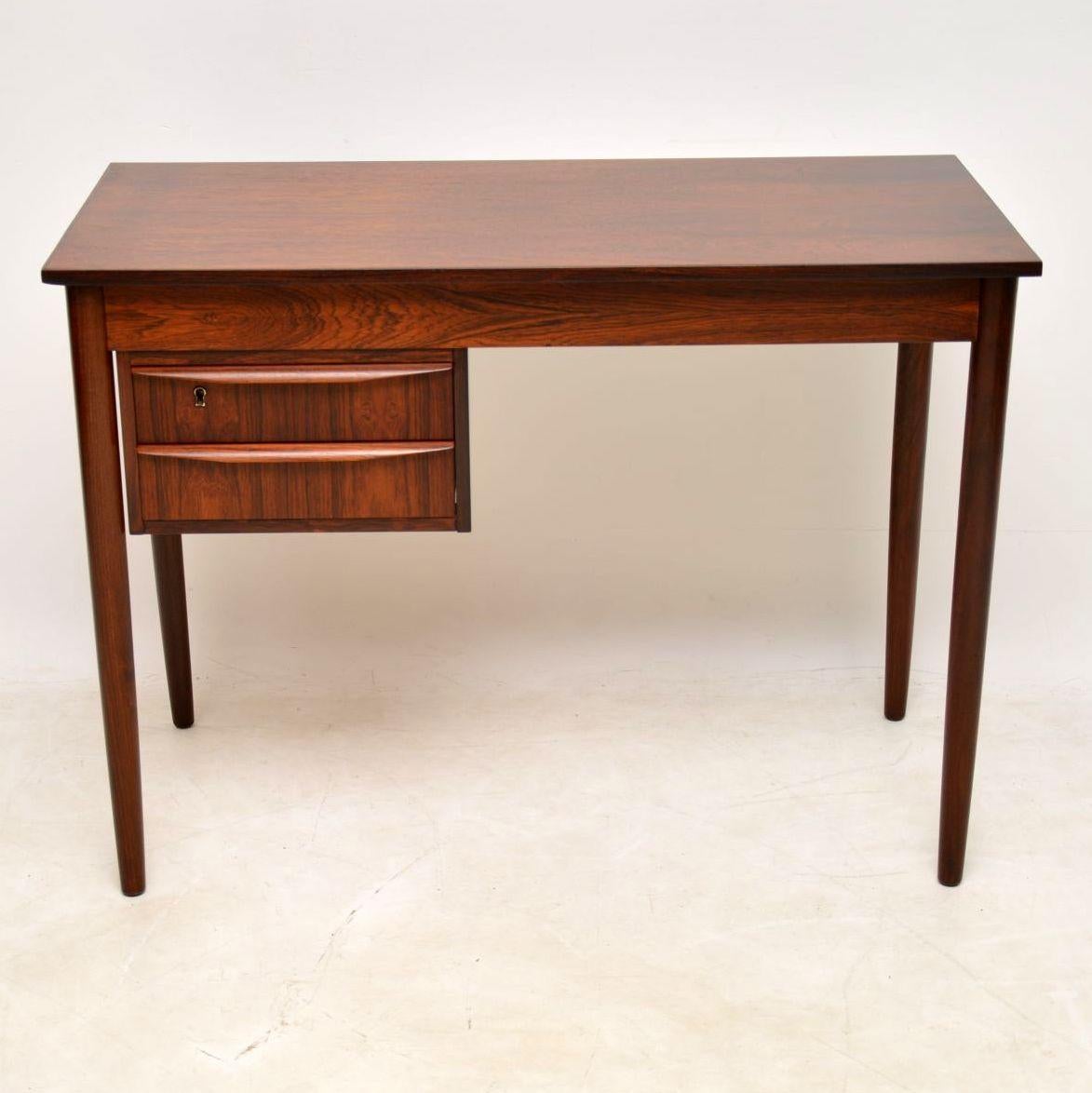 A stunning and very rare Danish desk dating from the 1960s, beautifully made in highly figured wood. This is really well made, it’s beautifully finished on the back too, so can be used as a free standing item. We have had this stripped and
