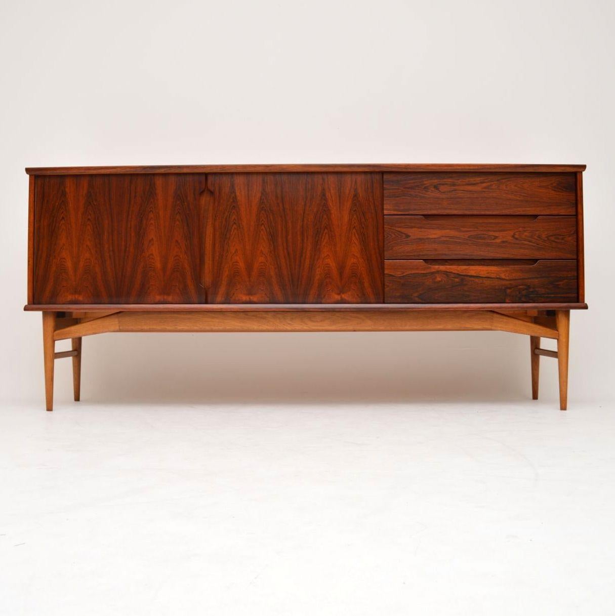 A stunning and extremely well made vintage Danish sideboard, this was made in the 1960s by Fredericia. It has a gorgeous colour and striking grain patterns throughout, this sits on solid oak legs. We have had this stripped and re-polished to a very
