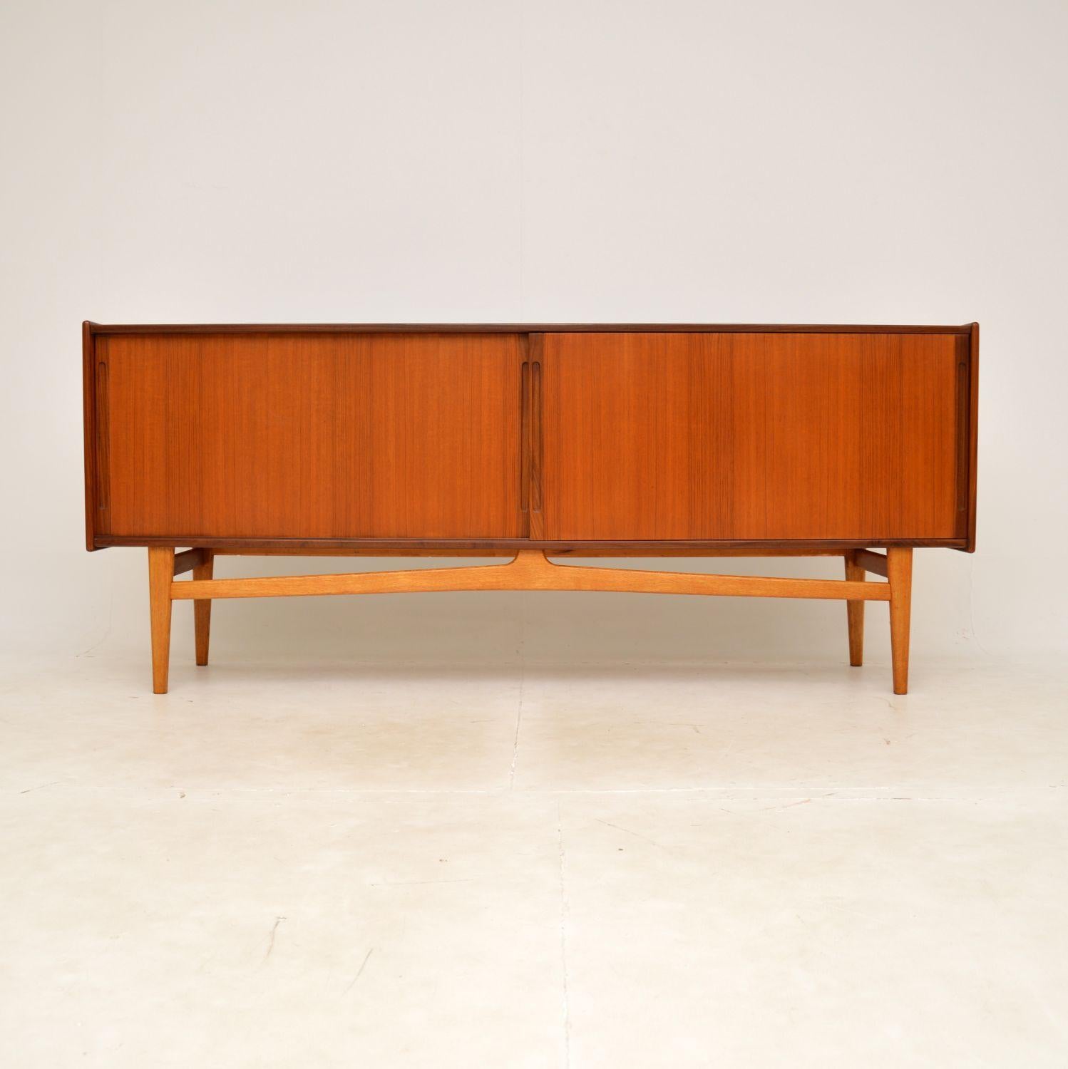 A superb vintage Danish sideboard in teak, this dates from the 1960’s.

It is very stylish, it is of amazing quality and is a great size. There are two sliding doors that open to reveal lots of storage space, with adjustable shelving and two