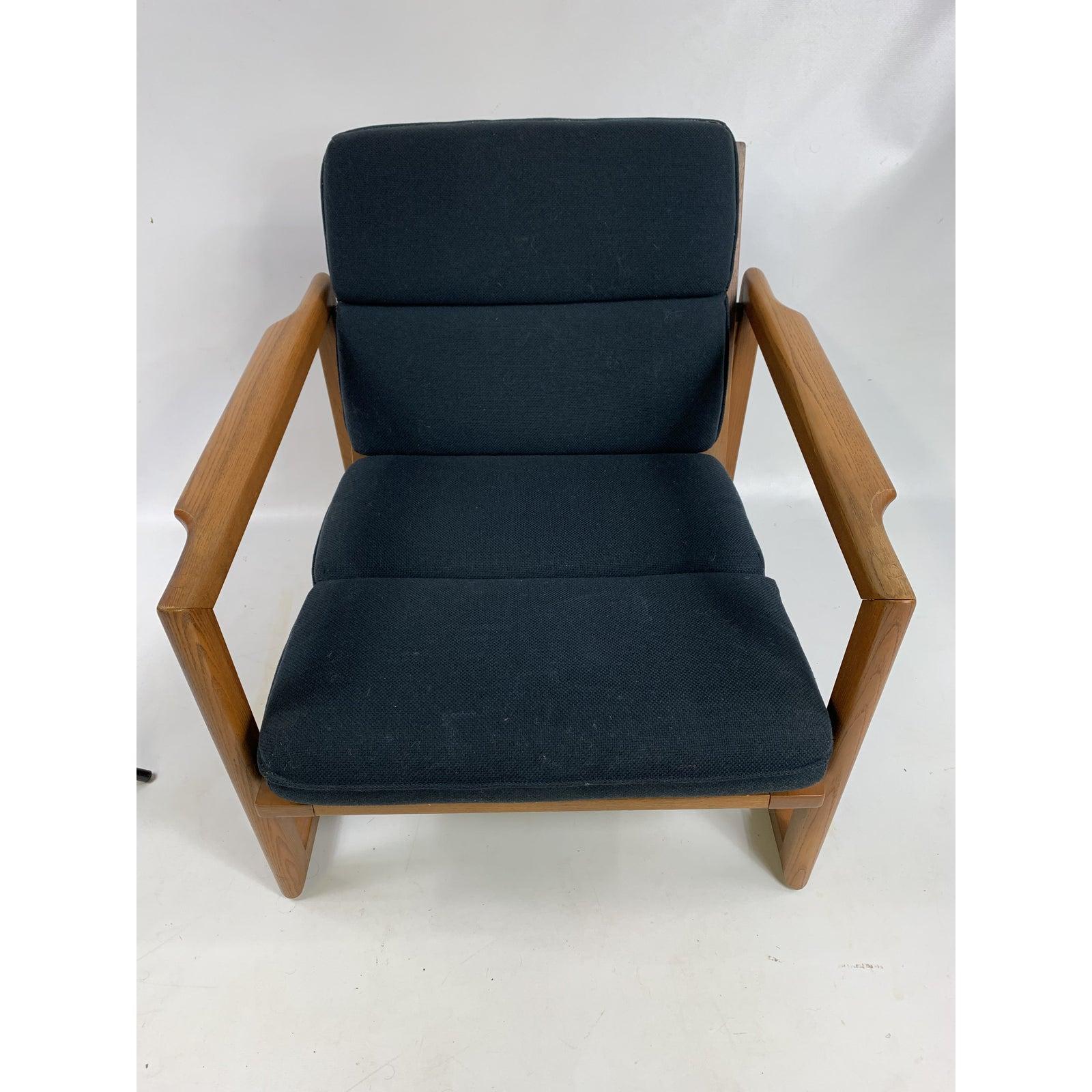 Very nice low sitting clean line solid walnut danish lounge chair.