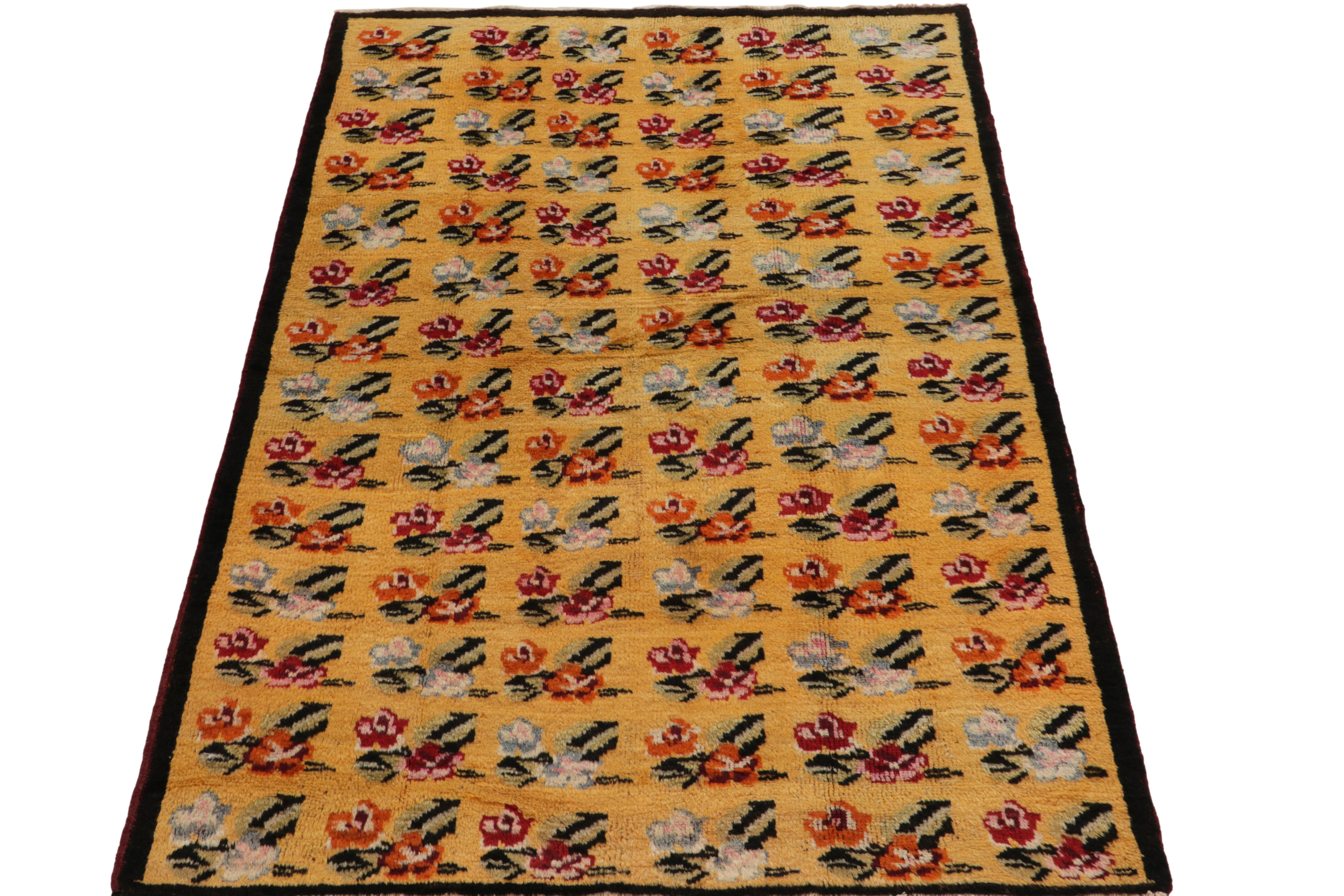 A 5x7 vintage rug in mid-century Deco style, from a bold Turkish designer commemorated in Rug & Kilim’s Mid-Century Pasha Collection. Hand-knotted in wool, the all over pattern depicts pink and red roses with pale green and pink accents against a