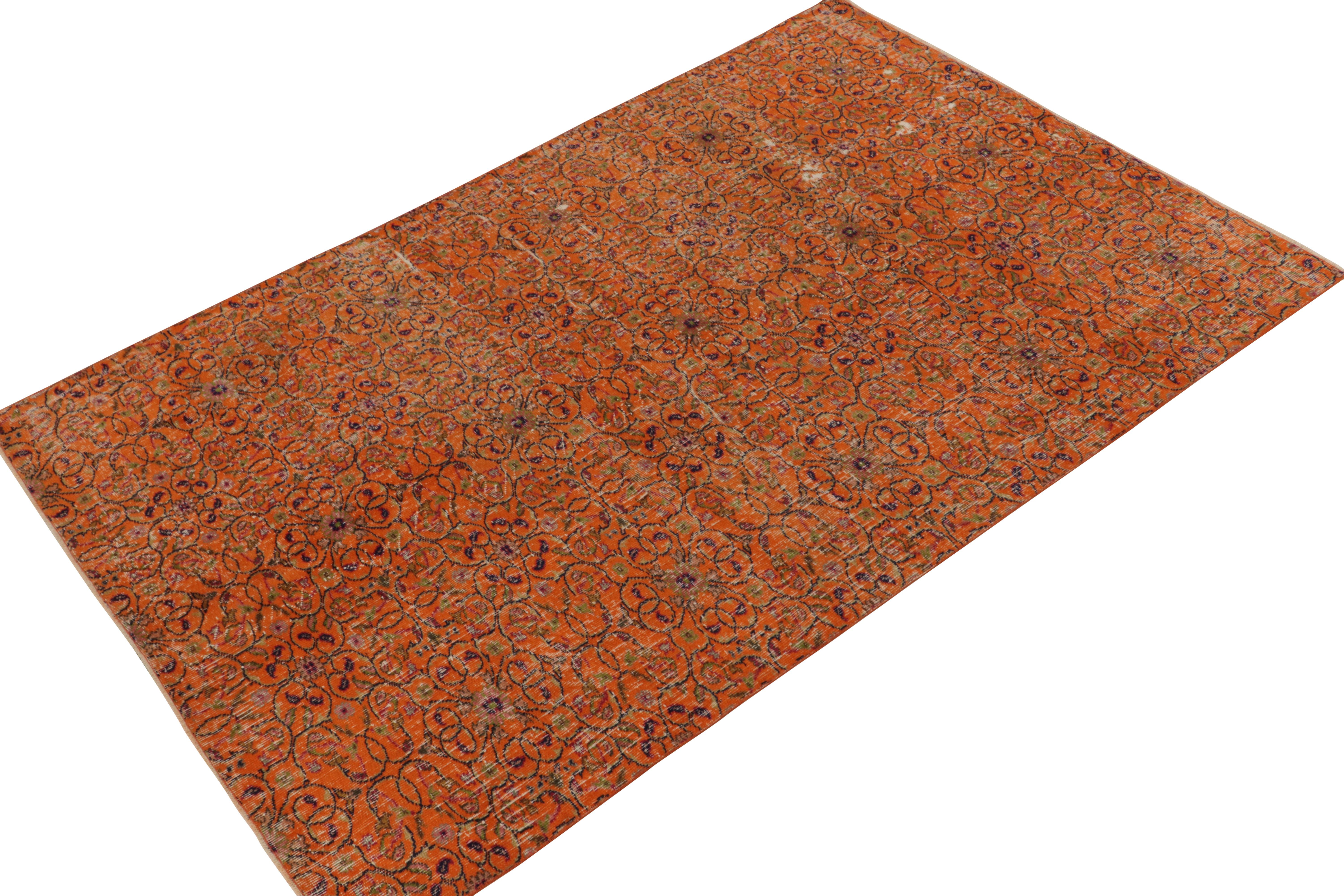 Hand-knotted in wool, a 6x9 vintage rug from a coveted Turkish designer, entering Rug & Kilim’s commemorative Mid-Century Pasha Collection. 

The 1960s take on Deco style relishes a geometric pattern in a rare colorway of orange playing