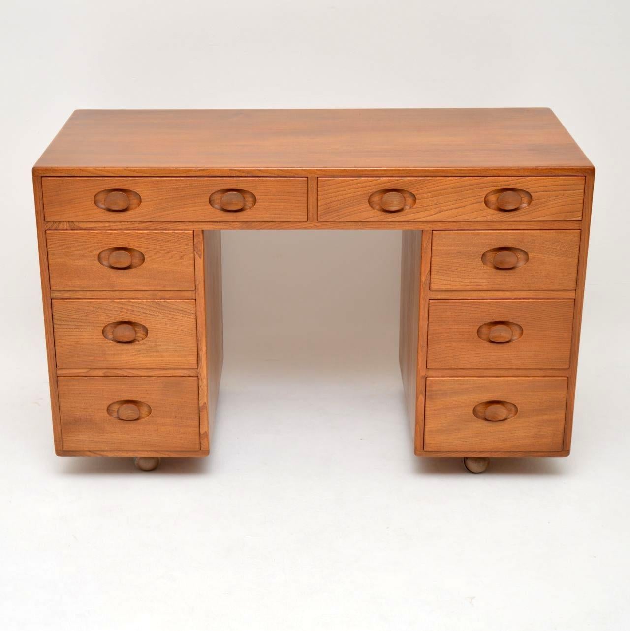 A very rare and extremely well made desk by Ercol, this dates from the 1960s-1970s. It’s in beautiful solid elmwood, and as with all Ercol products the quality is of the highest order. This is a very useful size and it’s in superb condition for its