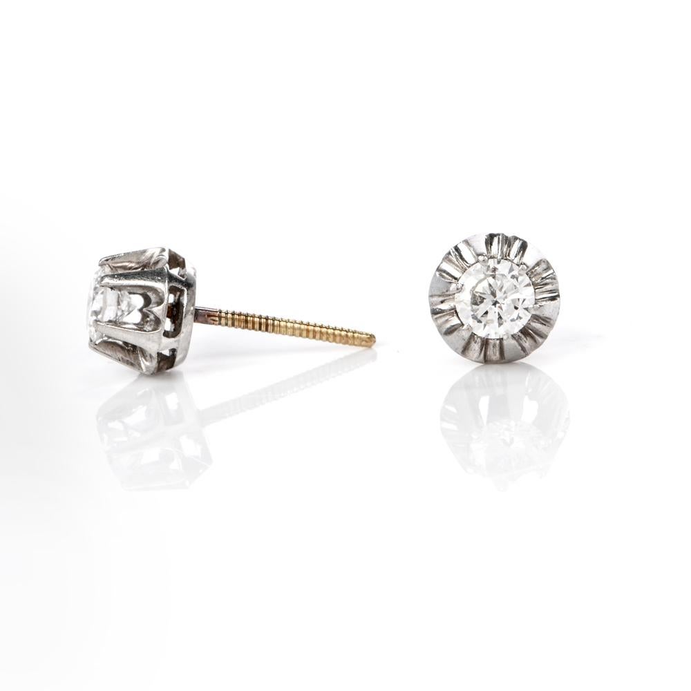 These sparking vintage diamond stud earrings are crafted in a combination of solid 18k white and yellow gold, weighing approx. 2.0 grams and measuring 6mm in diameter. These stunning early vintage earrings expose a pair of European-cut diamonds