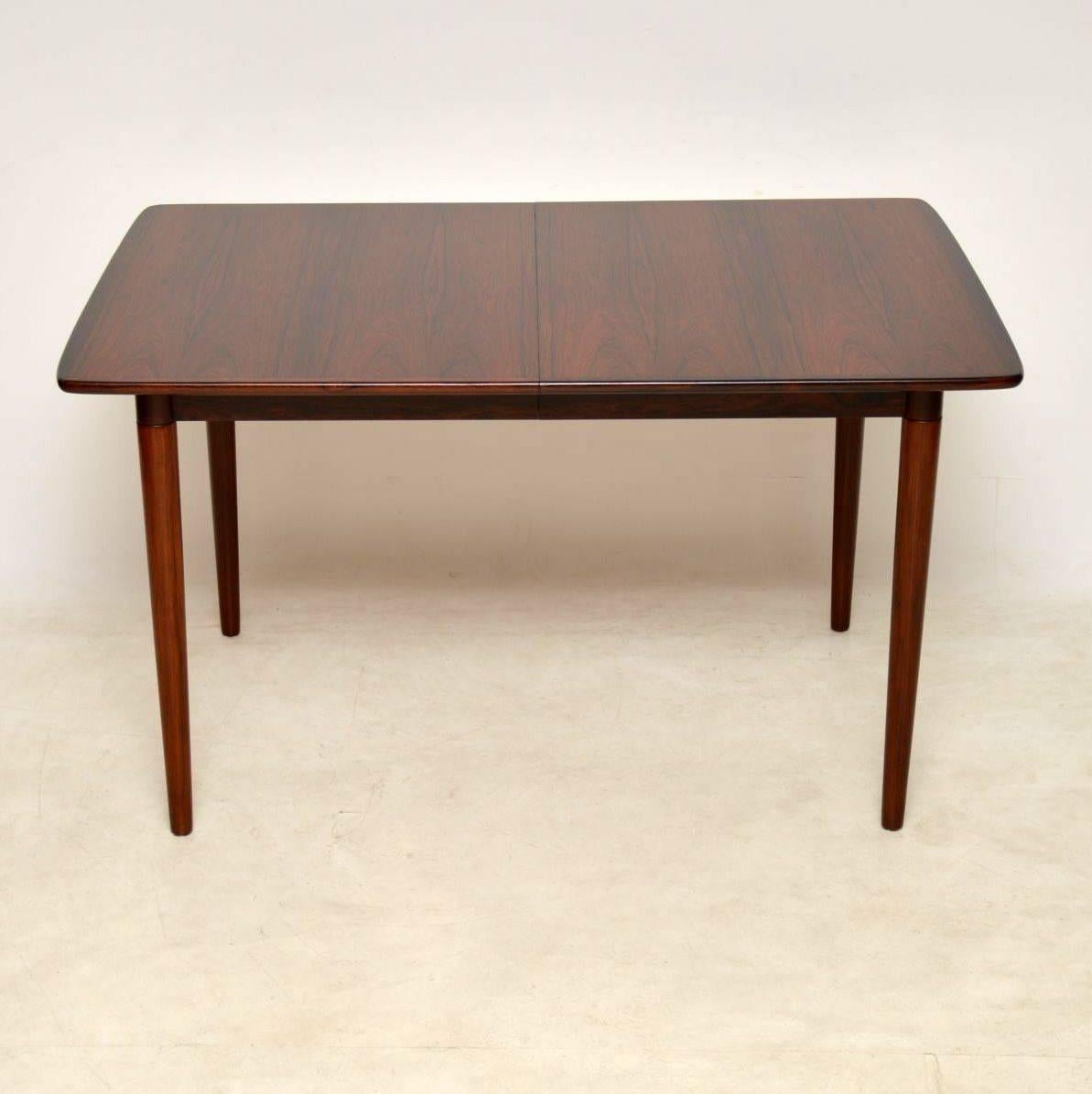 A superb vintage dining table made in Norway in the 1960s. It was designed by Rolf Rastad & Adolf Relling and produced by Gustav Bahus. The quality is outstanding, with beautiful wood grain patterns and a gorgeous color tone. We have had this