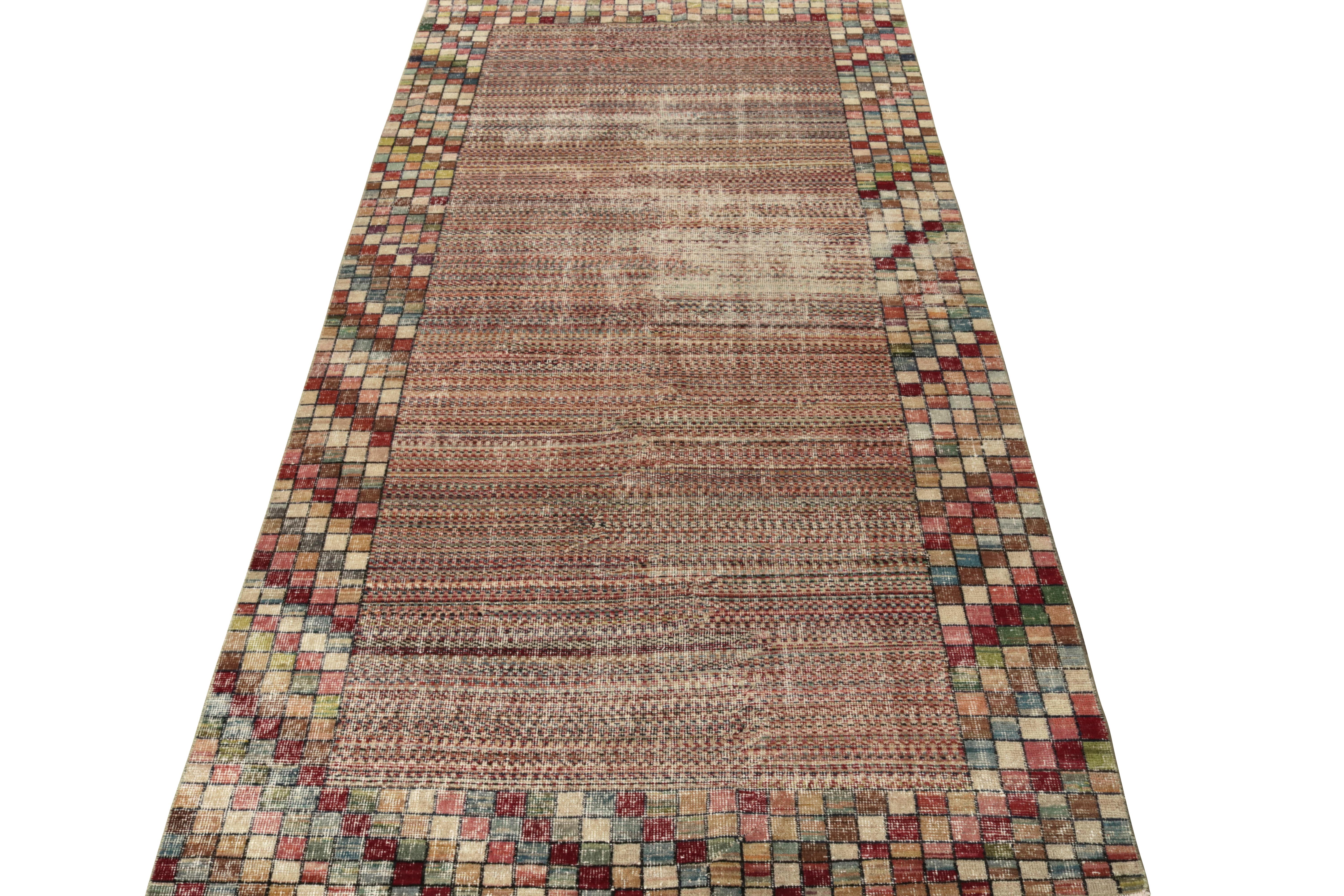 An exemplary vintage Art Deco rug originating from Turkey circa 1960-1970, joining our Mid-Century Pasha Collection connoting the works of a venerated Turkish artist. The 4x9 rug prevails on a comforting beige cocooned in a multicolor geometric