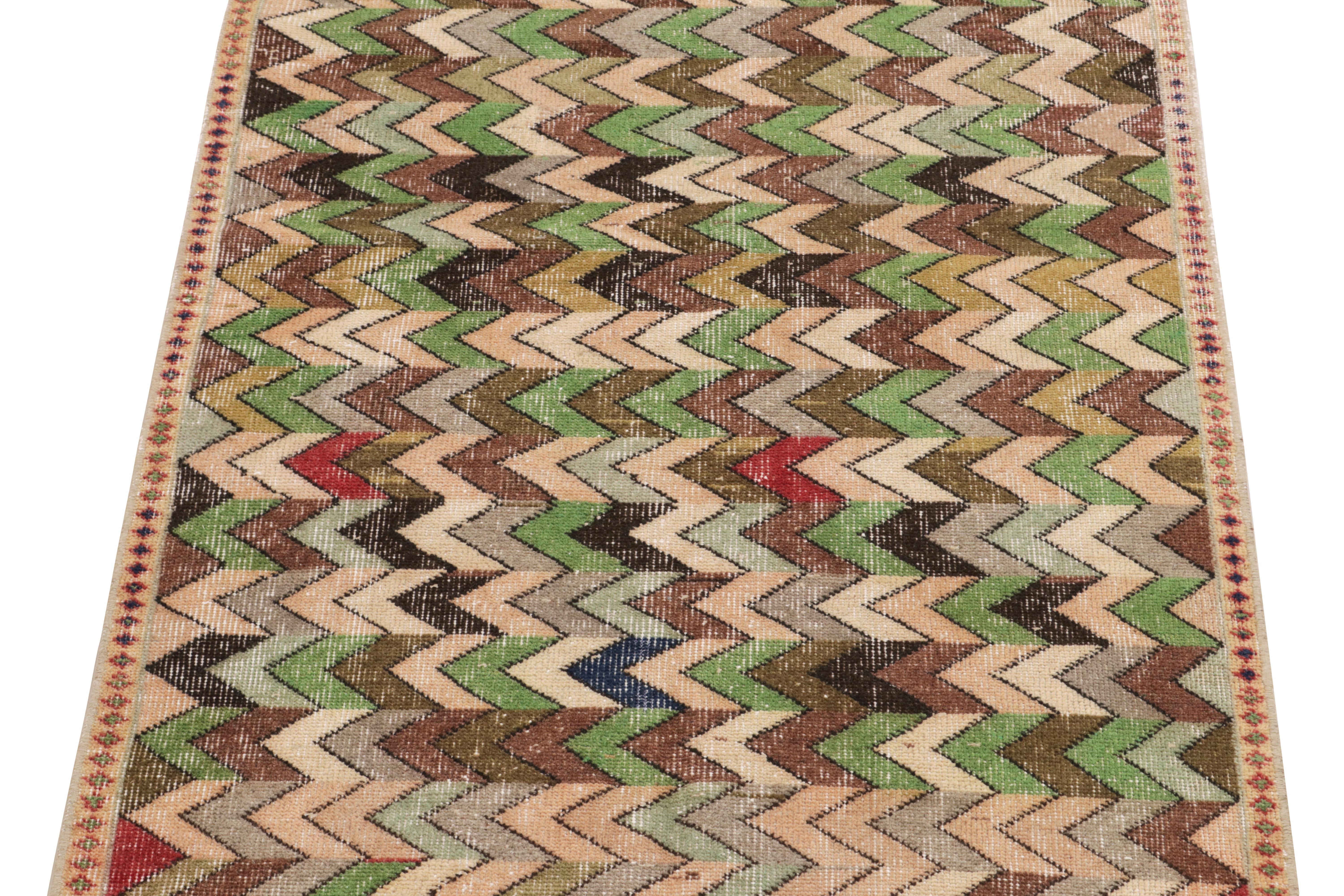 Turkish 1960s Vintage Distressed Runner in Green, Beige Chevron Patterns by Rug & Kilim For Sale