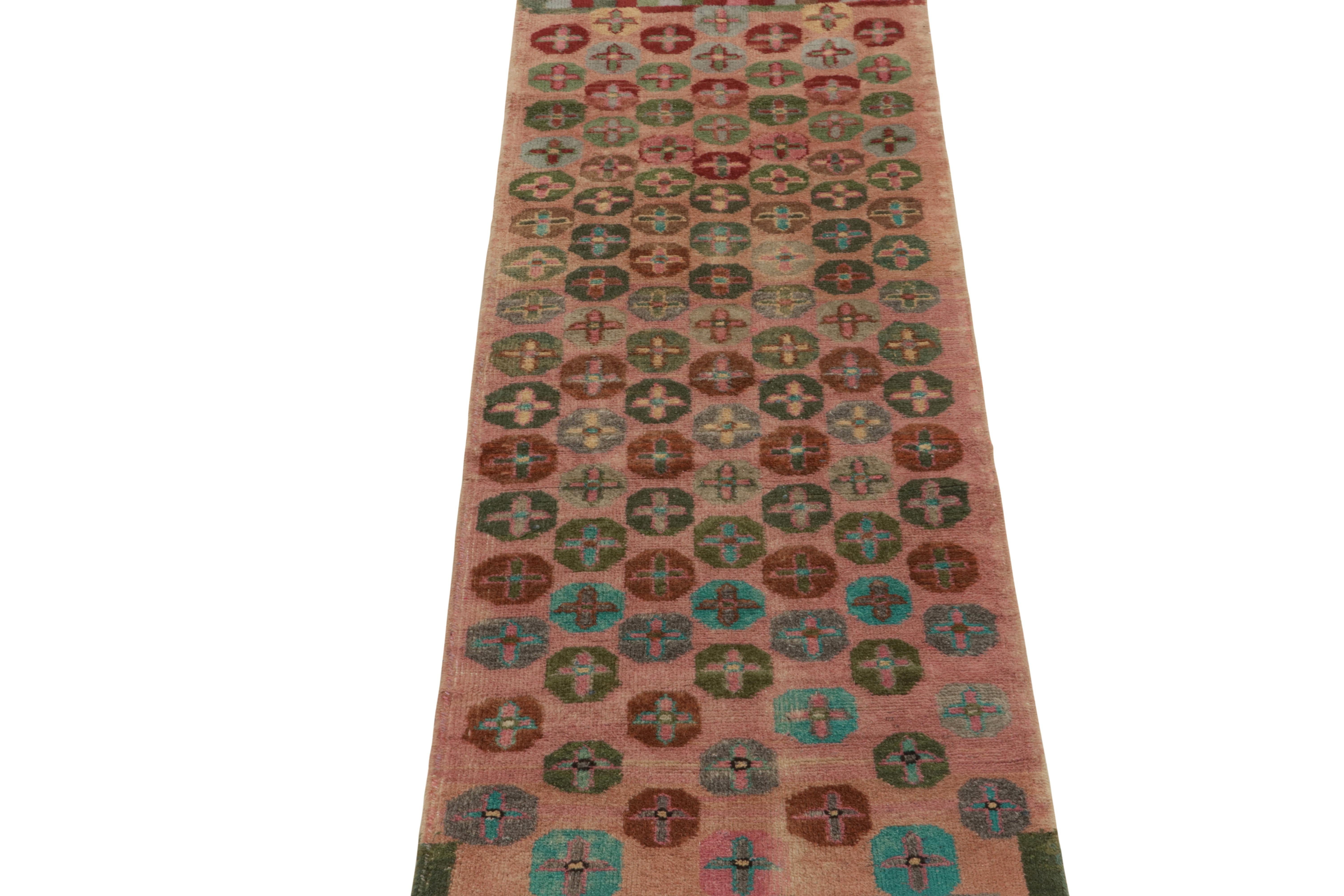 Turkish 1960s Vintage Distressed Runner in Pink, Red Geometric Patterns by Rug & Kilim For Sale