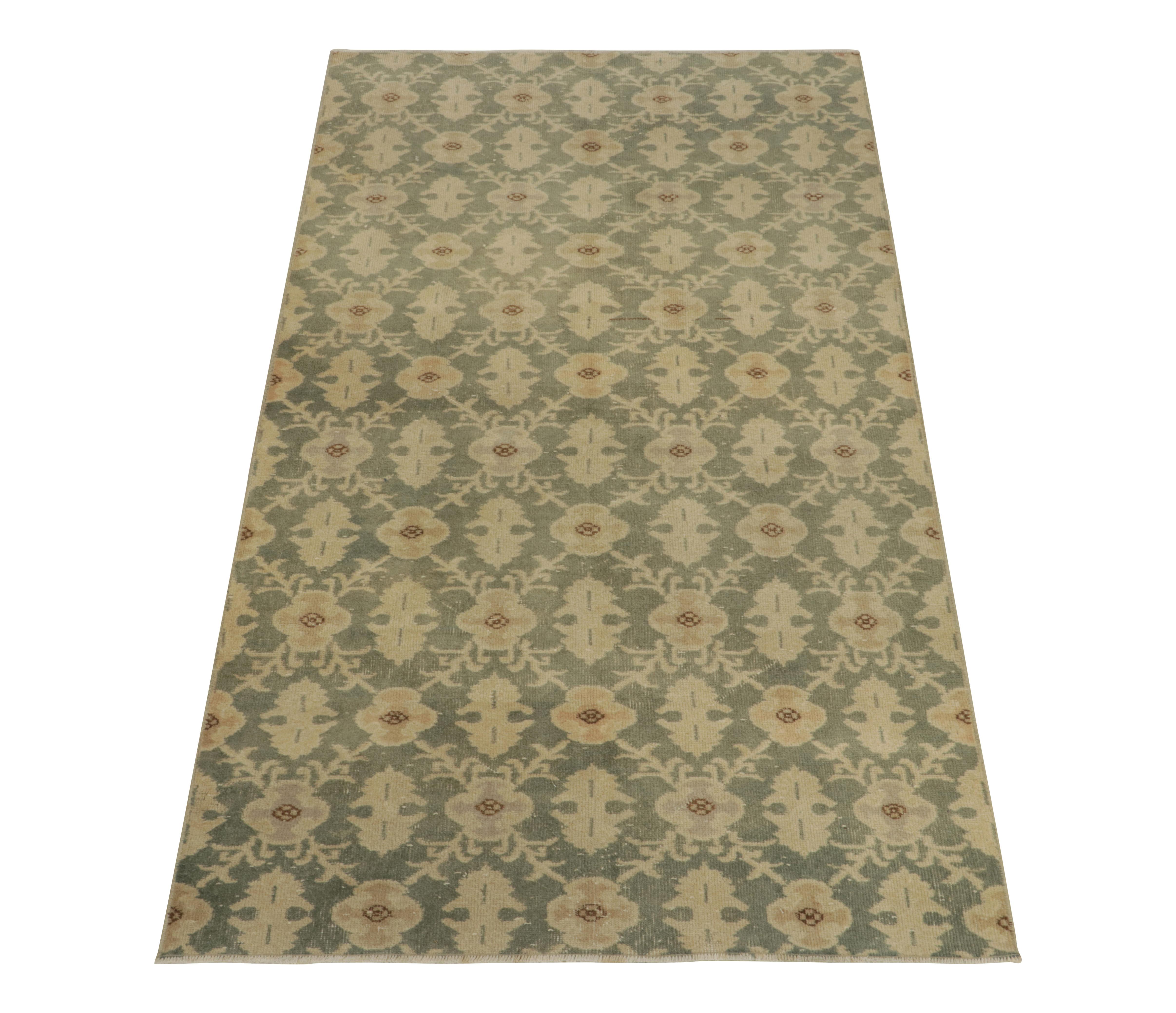 Hand-knotted in low wool pile, a 4x8 vintage rug in distressed style from the works of a revered Turkish atelier. 

Originating from Turkey circa 1960-1970, the rug transmutes art deco & nouveau sensibilities into a more European style sketch