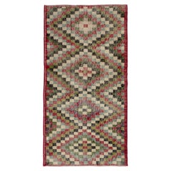Alfombra turca vintage envejecida multicolor geométrica de los años 60 by Rug & Kilim