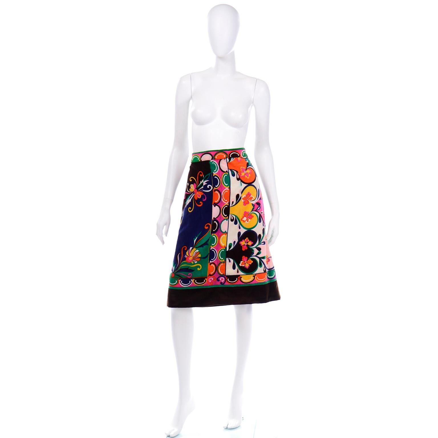 This fabulous vintage Pucci A line skirt is in a fun and colorful green, brown, orange, pink, yellow, blue, and pale pink printed velvet.  Skirts like these are easy to wear with a number of different tops, jackets and sweaters. The back of the