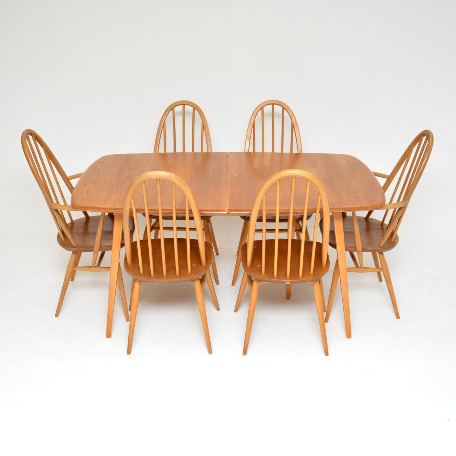 A stunning and iconic vintage Ercol dining table and chairs. These were made in England, they date from the 1960’s.

The dining table is the Grand Windsor model, it comes with an extra leaf to extend the dining area considerably. The top is solid