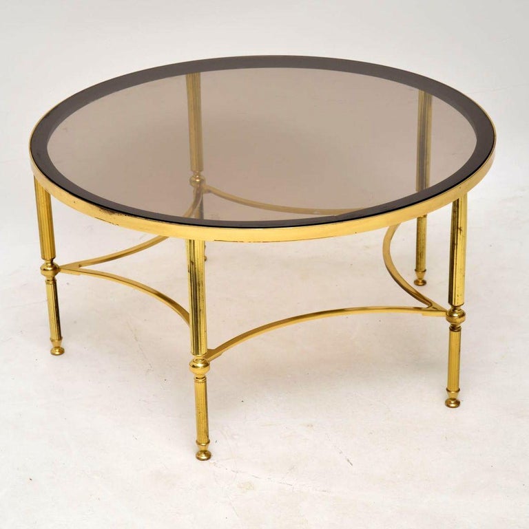 1960s Vintage French Brass and Glass Coffee Table at 1stdibs Round brass coffee table with glass top and shelf, 1970s.