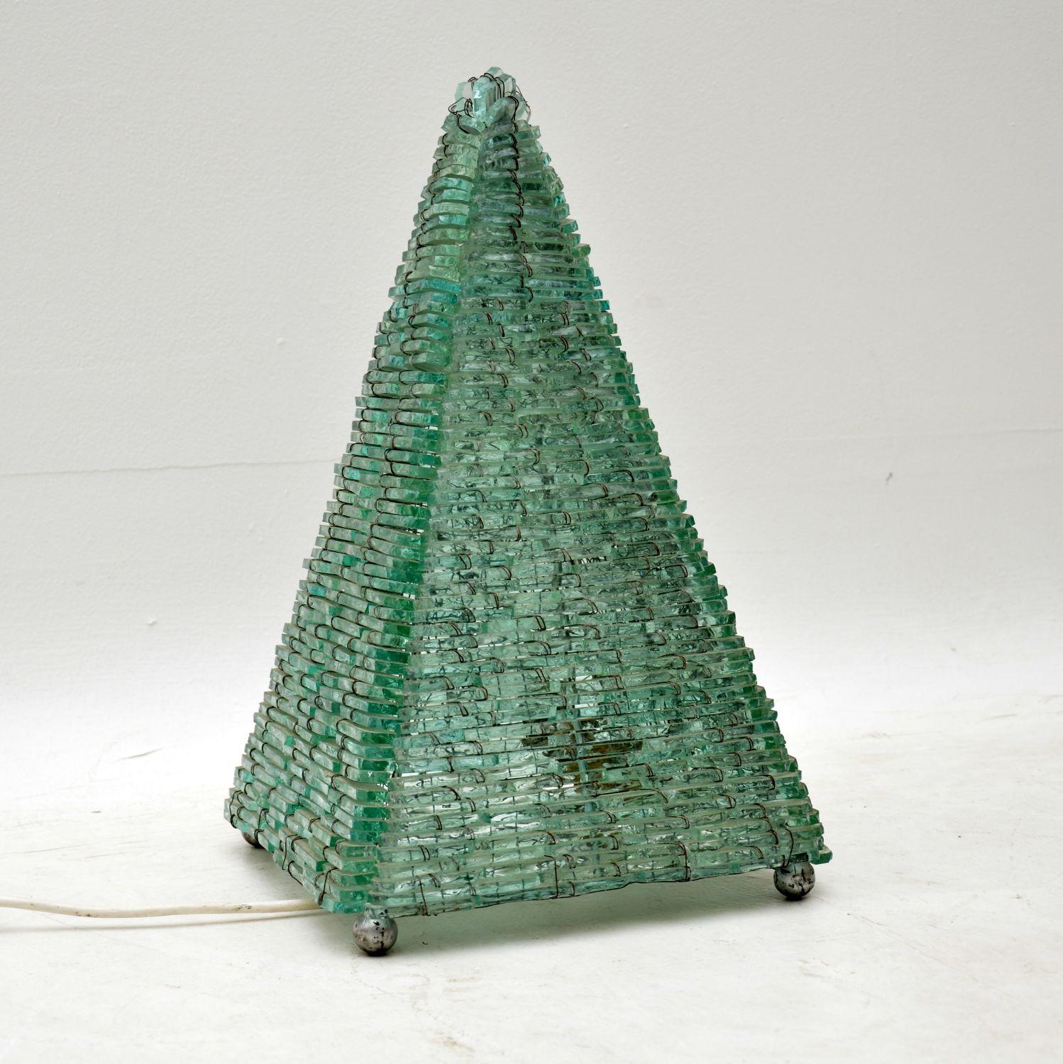 A beautiful and intricate vintage glass pyramid table lamp, made in France and dating from the 1960s. This is in excellent condition, it’s in good working order and has been PAT tested for safety.

Measures: Width 26 cm, 10 inches
Depth 26 cm, 10