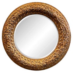 Espejo redondo de madera dorada tallada a mano de los años 60 con relieve floral