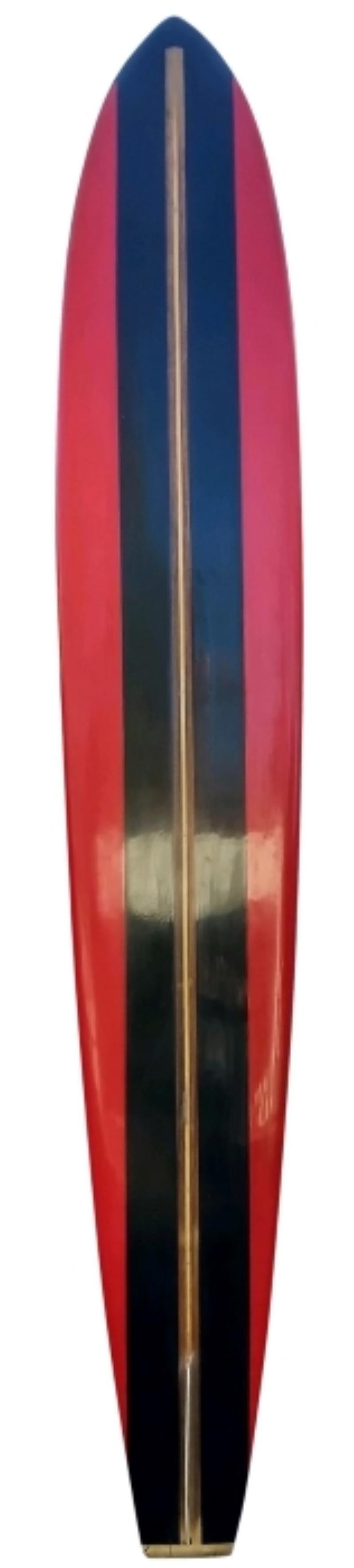 1963 Hansen Surfboards Waimea Bay big wave surfboard. Features black panels with red rails, redwood/balsawood t-band stringer, and unique low-profile single fin. This surfboard was built to ride the biggest waves in Hawaii, at the infamous big wave