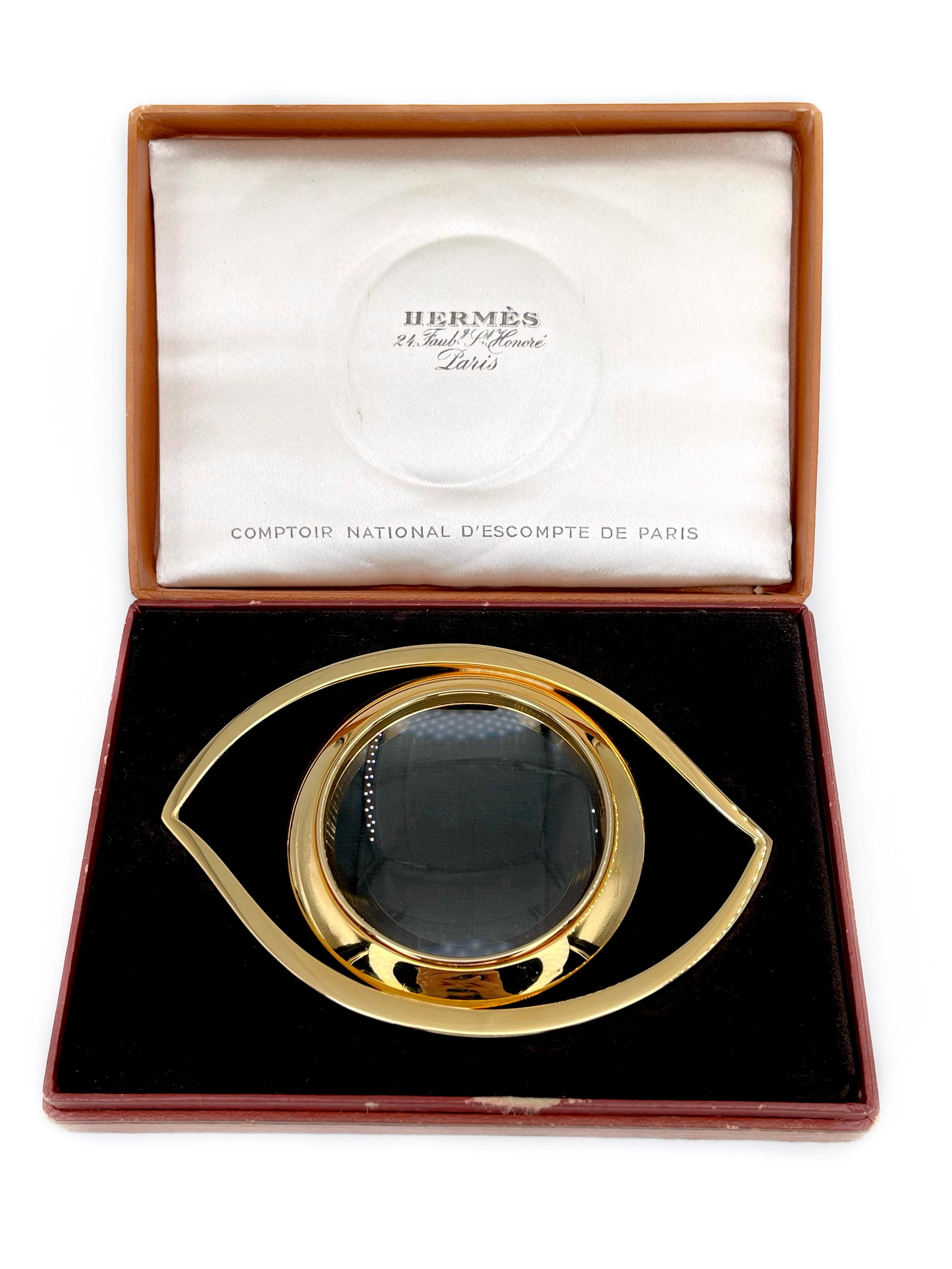 This is a desk magnifying glass designed by Jean Cocteau for Hermes in 1960’s. It represents the Eye of Cleopatra in a gilded metal. 

The piece can be used as an interior detail or also worn as a massive pendant or scarf ring. 

Signed: “Hermès.