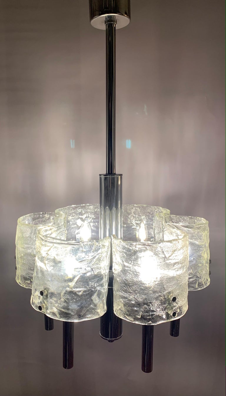 1960s Italian polished chromed metal with crescent-shaped Murano glass. Designed by Carlo Nason for Mazzega. The six crescent-shaped mottled clear Murano glass shades fit onto the frame with two small feature screws and surround the bulb inside. Six