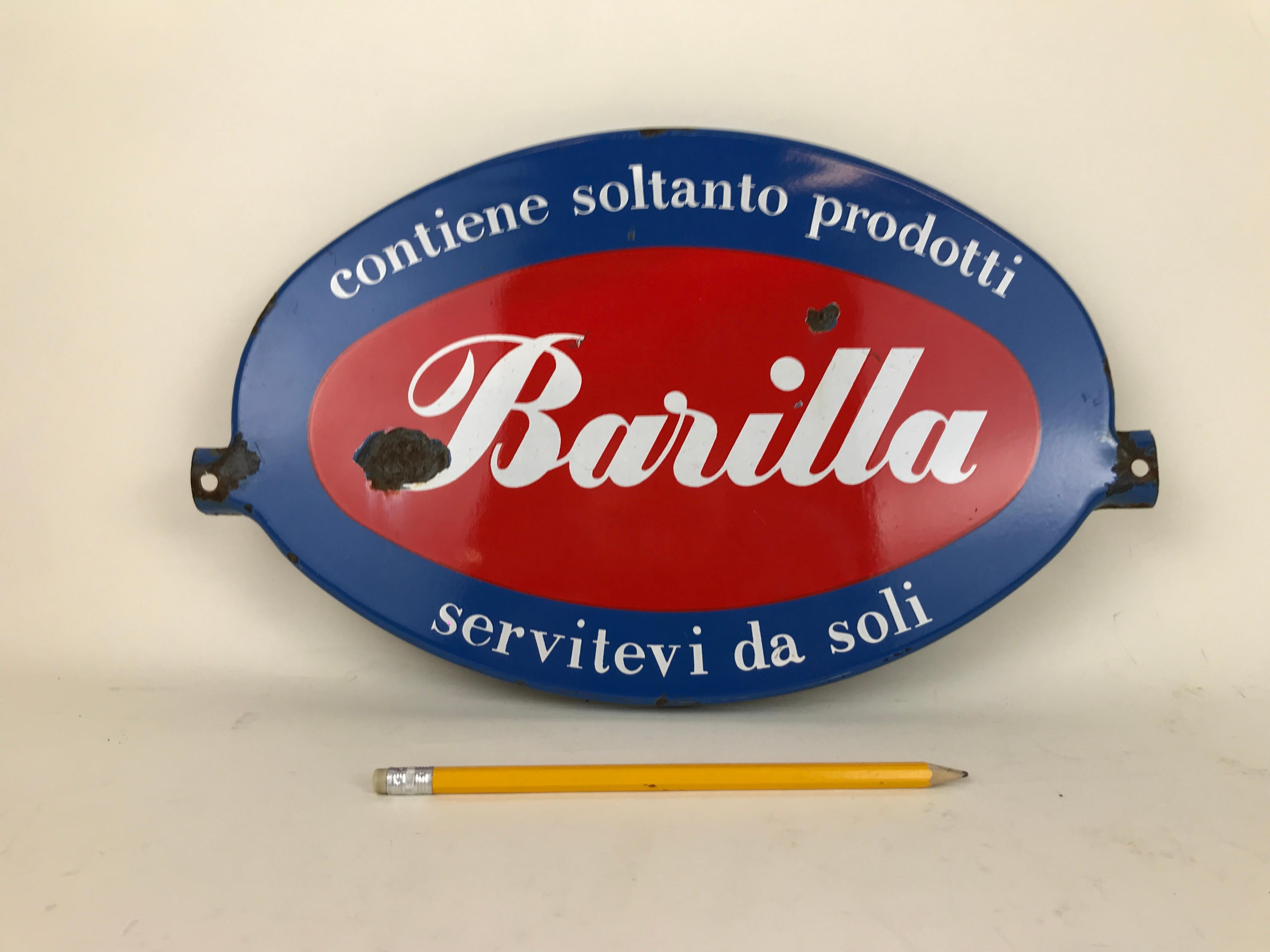 Vintage metal enamel advertising oval sign Barilla produced in Italy, in the 1960s. 

The sign in blue, white and red was used on top of Barilla mono-brand display unit. 
It shows the slogan:

Contiene soltanto prodotti
Barilla
Servitevi da