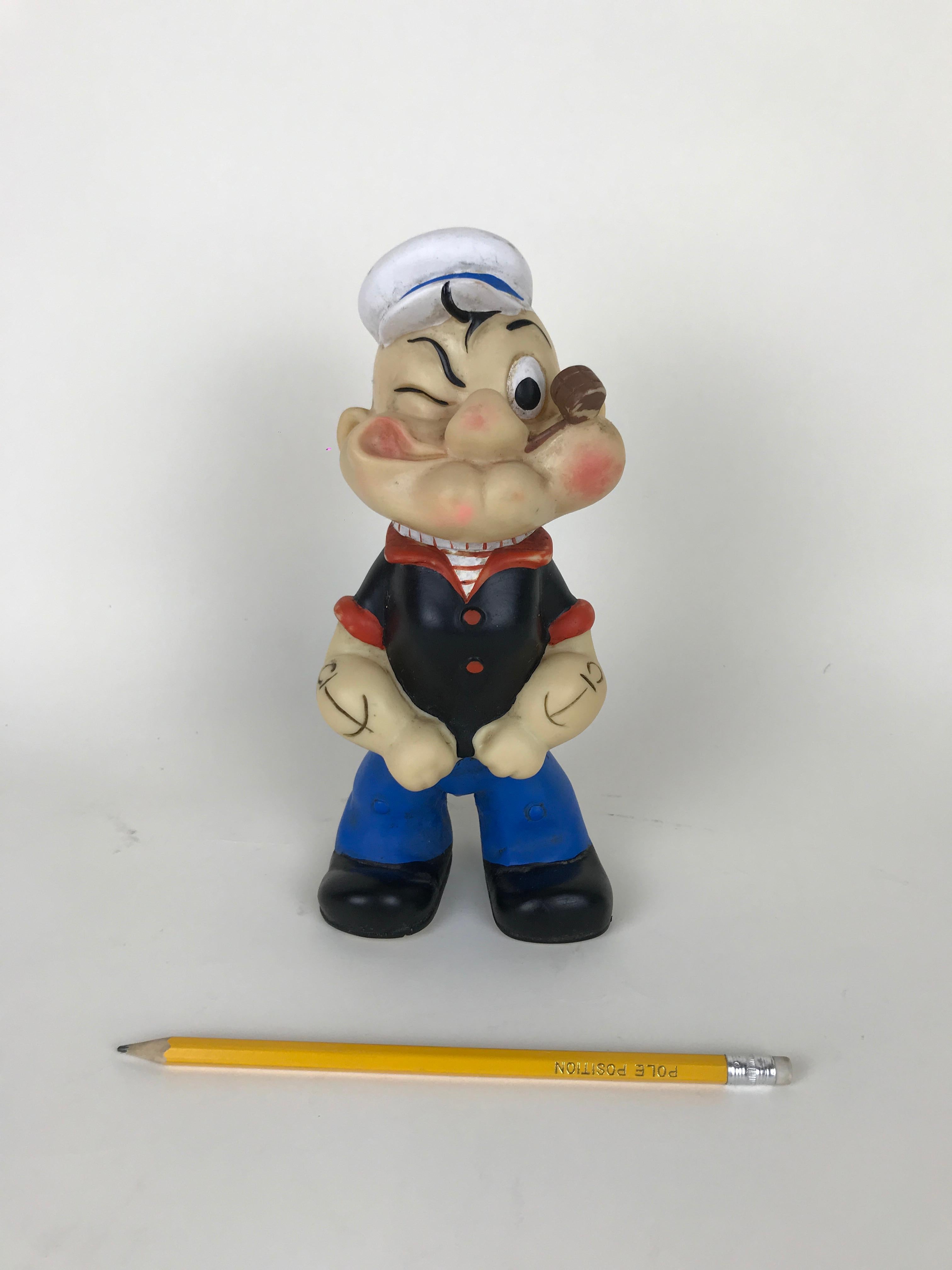 2019 marks the 90th birthday of the famed comic character Popeye the Sailor.

This very rare vintage Popeye the Sailor rubber squeak toy was made in Italian by Italo Cremona toy maker in the 1960s.

The whistle at he bottom of one foot is
