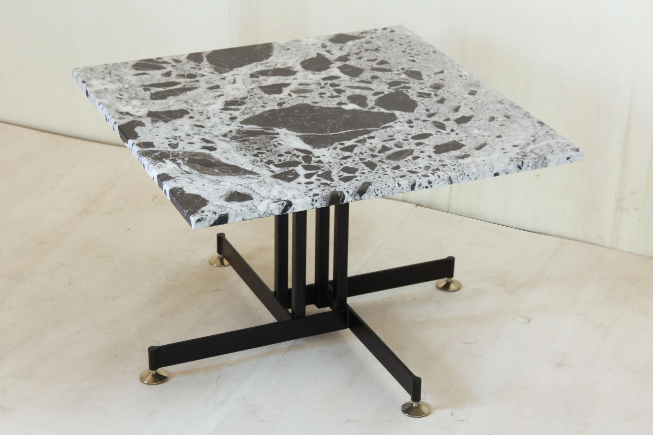 Vintage Marble Coffee Table, Italy 1960s.
A rare made in italy square shaped vintage side / coffee table with bicolor black and white marble top and iron structure with brass feet, 1960s vintage item with unique design touch. The side table has been