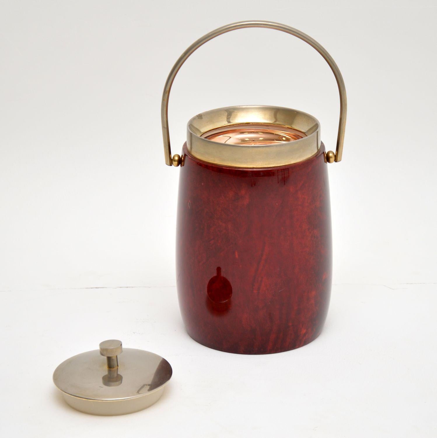This vintage ice bucket was designed by Aldo Tura, it was made in Italy in the 1960s. It’s made from lacquered goat skin parchment and steel, with an insulated interior. This is in excellent original condition, with only some extremely minor surface