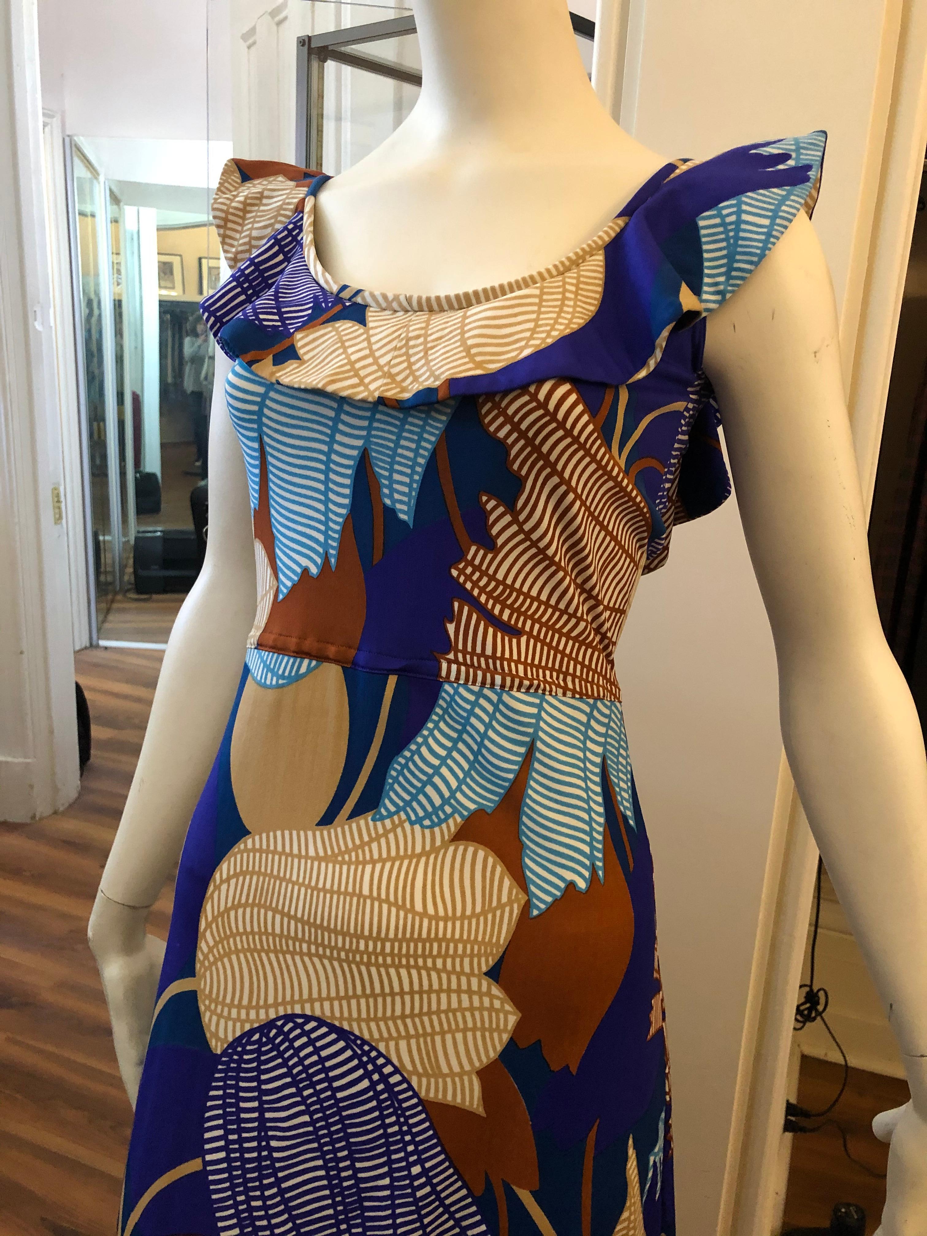 Very nice Lanvin tulip print dress designed by Belgian born Jules-Francois Crahay with a frilly collar which extends to a slightly lower back drop. Can be worn as a sun dress or accessorize and wear to any event. There is a hidden center back hidden