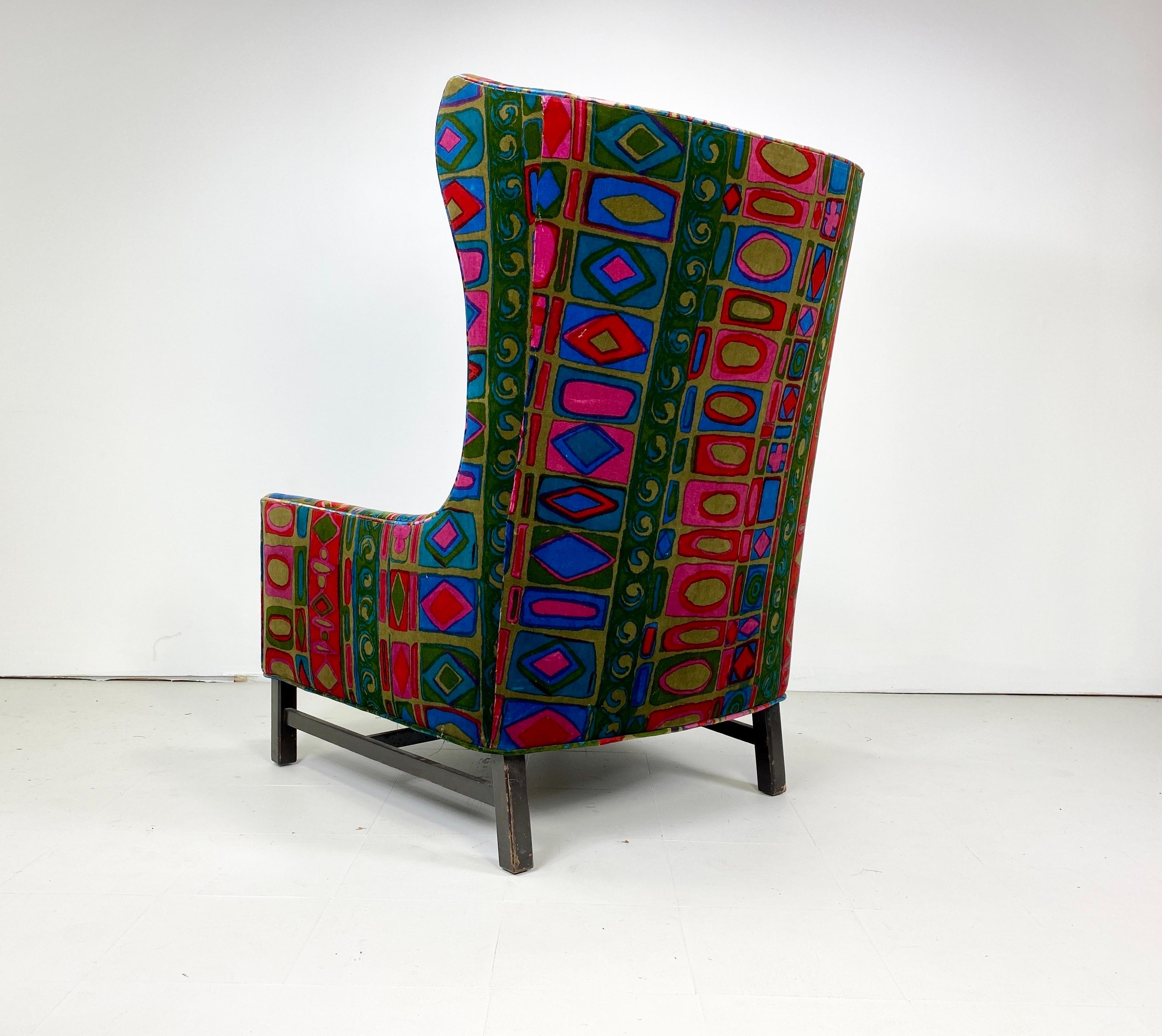 1960s Vintage Wing Back Lounge Chair upholstered in a stunning vintage Jack Lenor Larsen upholstery. Stained walnut base.


