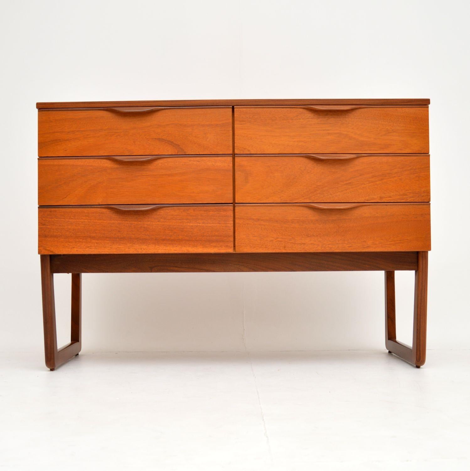 A stylish and useful vintage chest on legs in mahogany, this dates from the 1960s. It has a sleek and elegant design, we have had this stripped and re-polished to a very high standard; the condition is superb throughout. The legs can be removed for