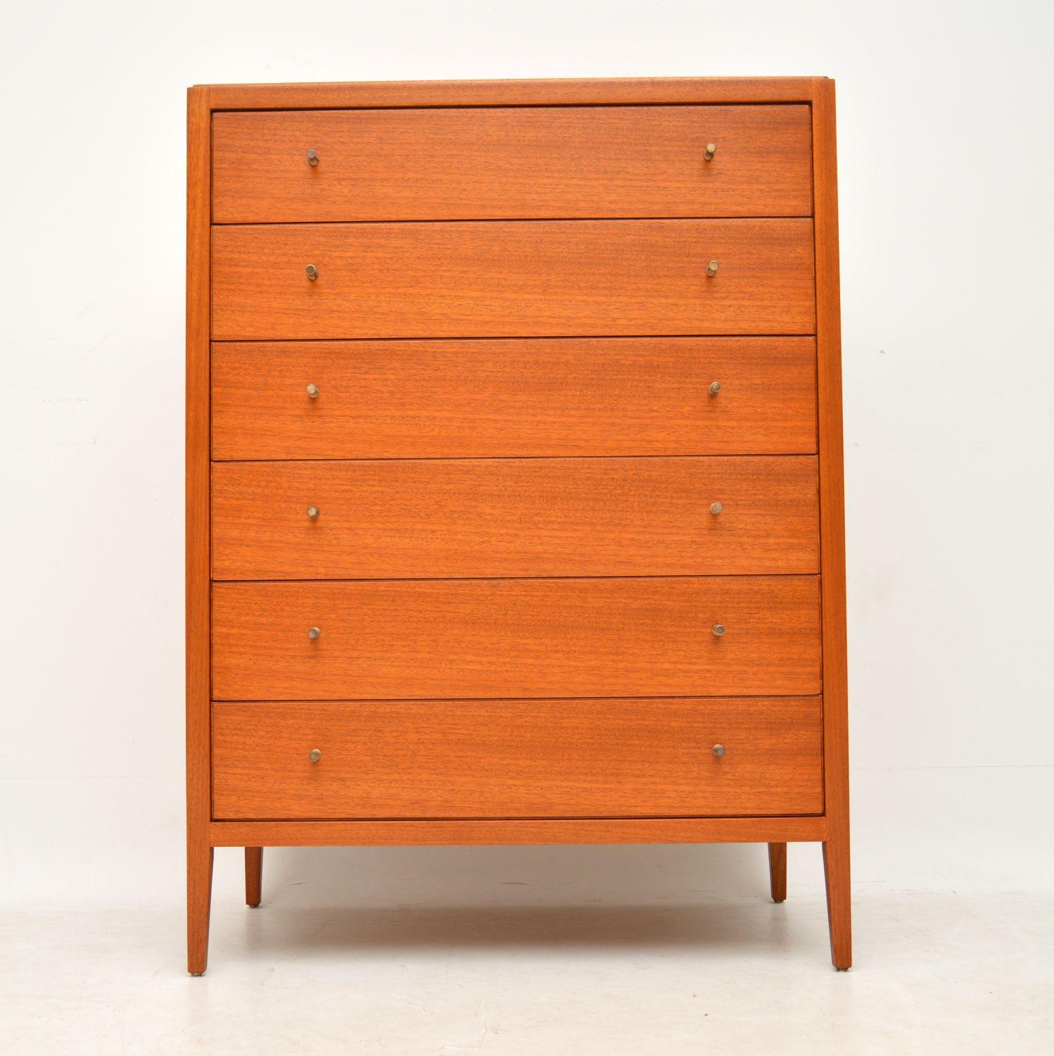 A beautifully made vintage tall boy chest of drawers in mahogany, this dates from the 1960s. It was made by Loughborough furniture, a little known and very underrated British manufacturer. The design and quality are amazing, the mahogany has a