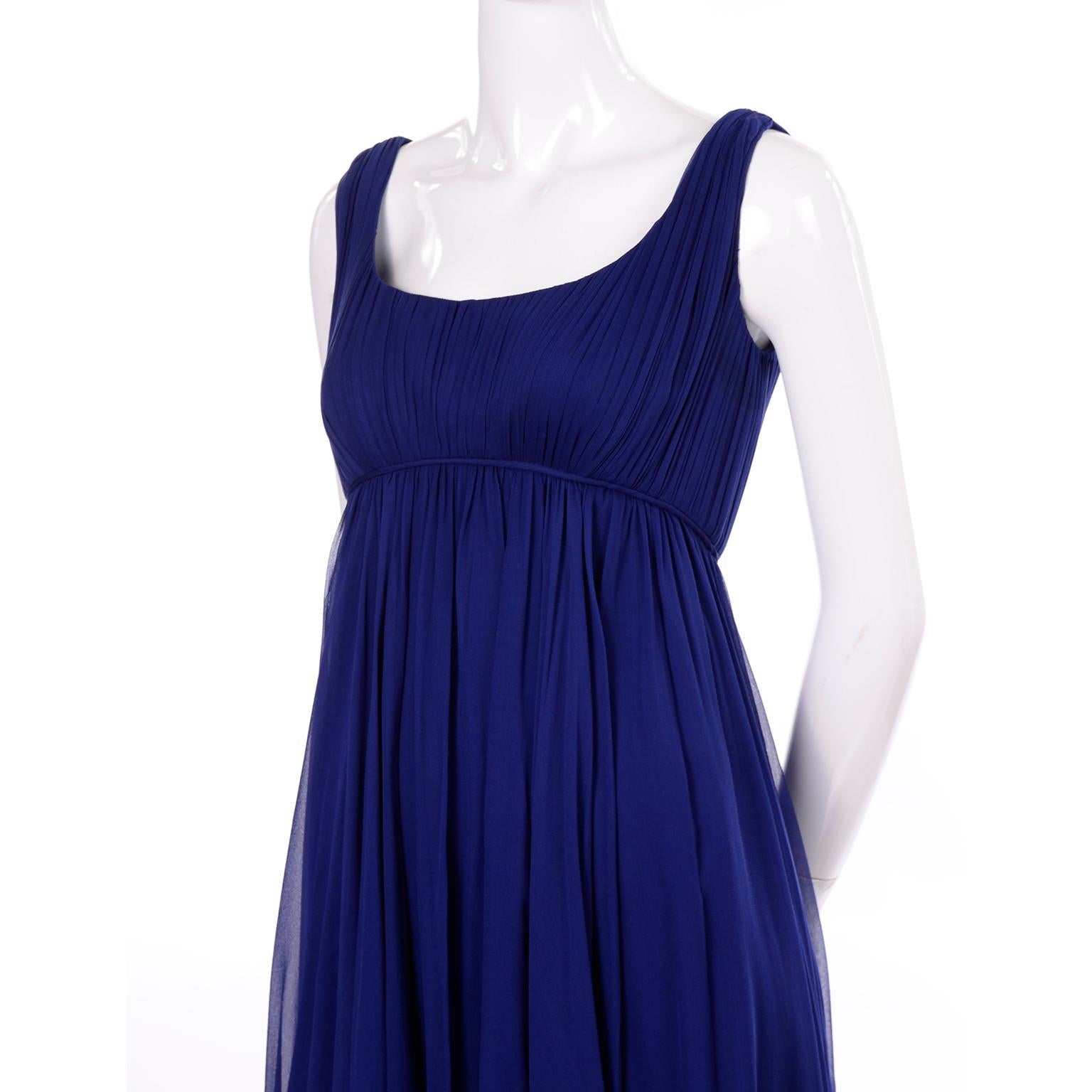 This is a lovely vintage dress designed by Malcolm Starr in the 1960's. The dress is in a beautiful shade of blue silk chiffon and has a low back and empire waist. Malcolm Starr's designs were worn by prominent women in the 1960's and 1970's.  His