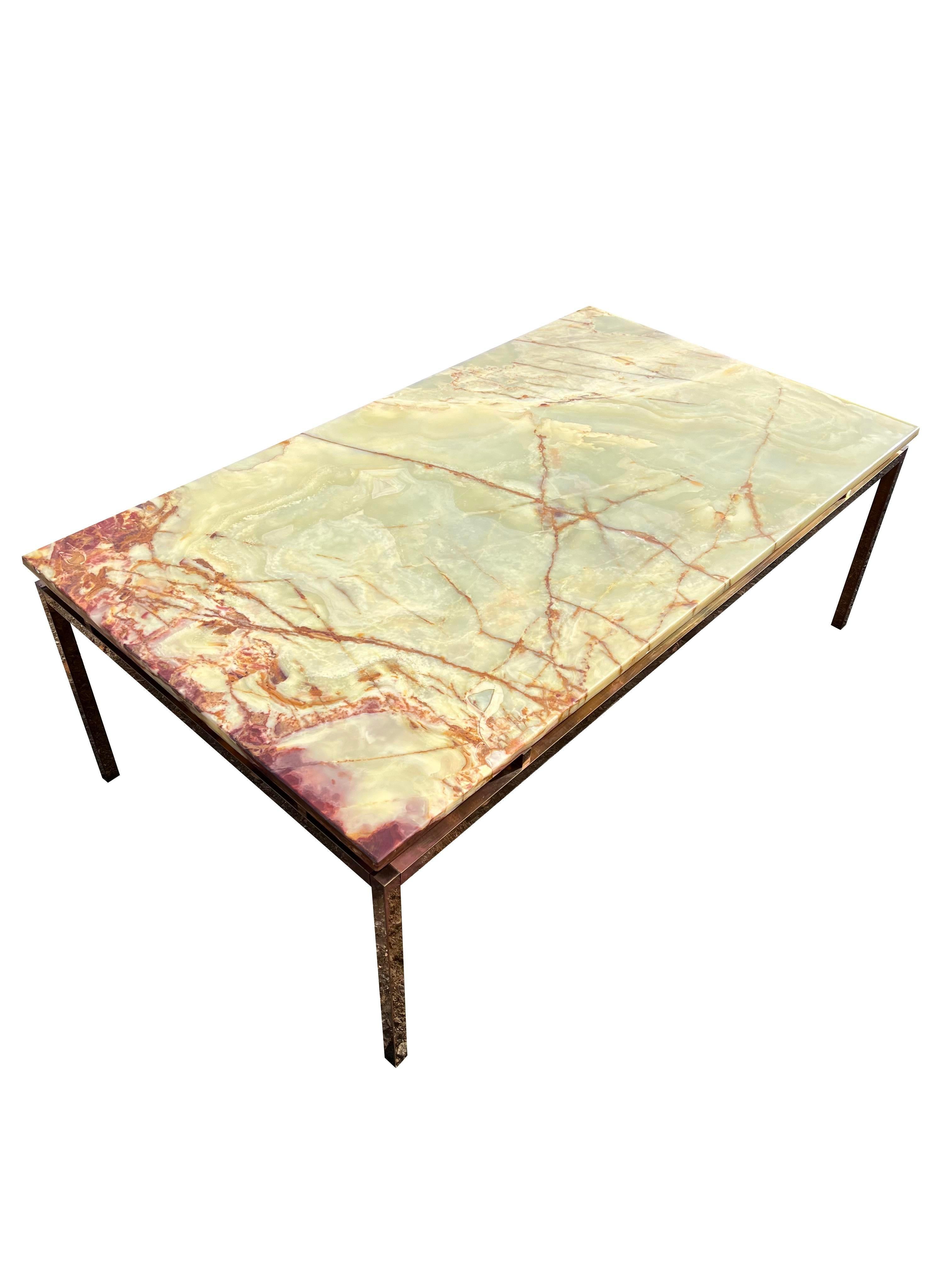 Modern Vintage Marble Stone Coffee Table with Brass Base in Florence Knoll Style.

Elevate your living space with this stunning Modern Vintage Marble Stone Coffee Table. Inspired by the iconic designs of Florence Knoll, this unique piece combines
