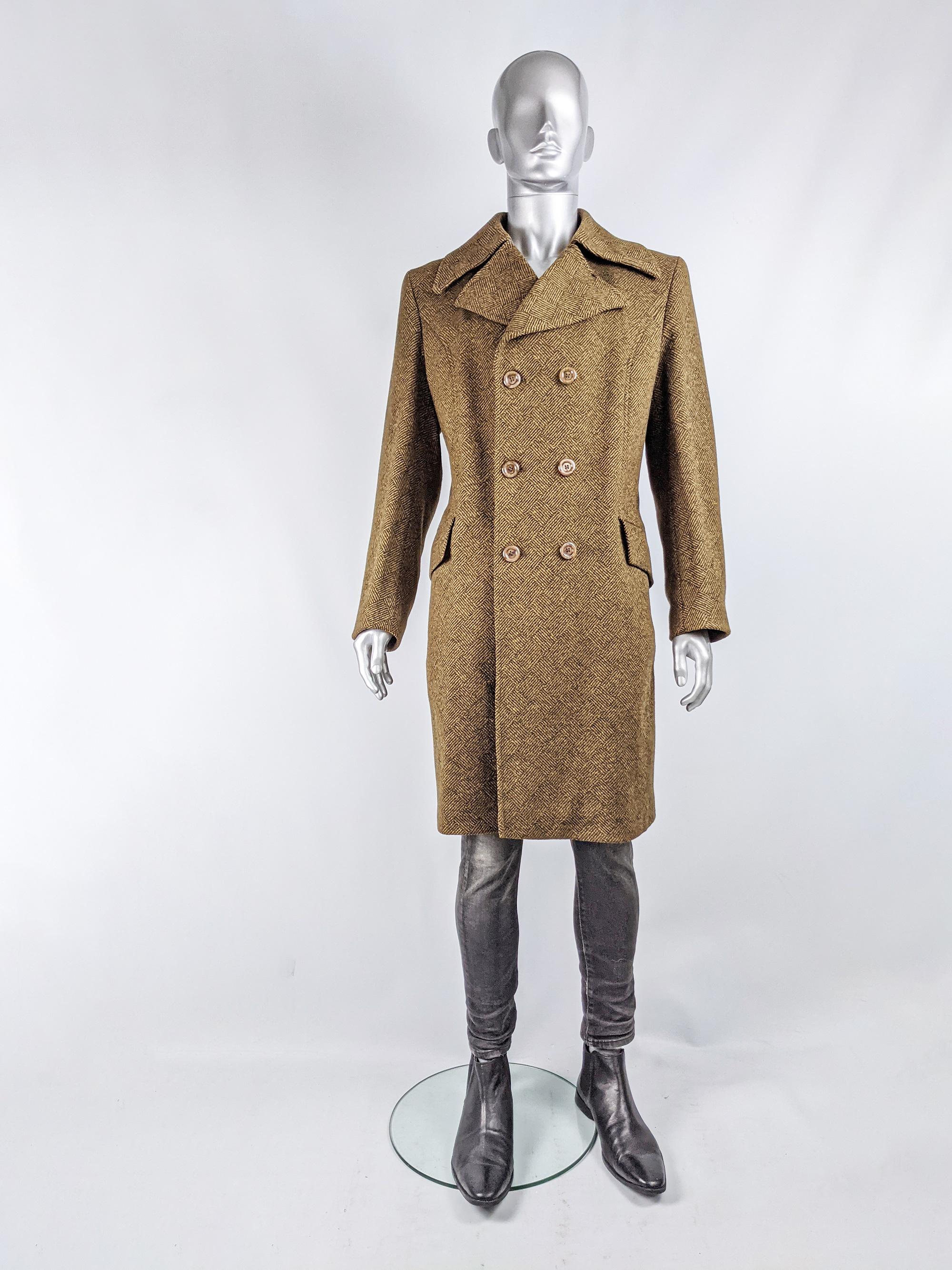 An excellent vintage mens long coat from the late 60s by White & Fuller. In a brown and black wool tweed with a large collar, tailored fit and double breasted buttons for a classic, Edwardian inspired look.

Size: Not indicated; fits like a men's