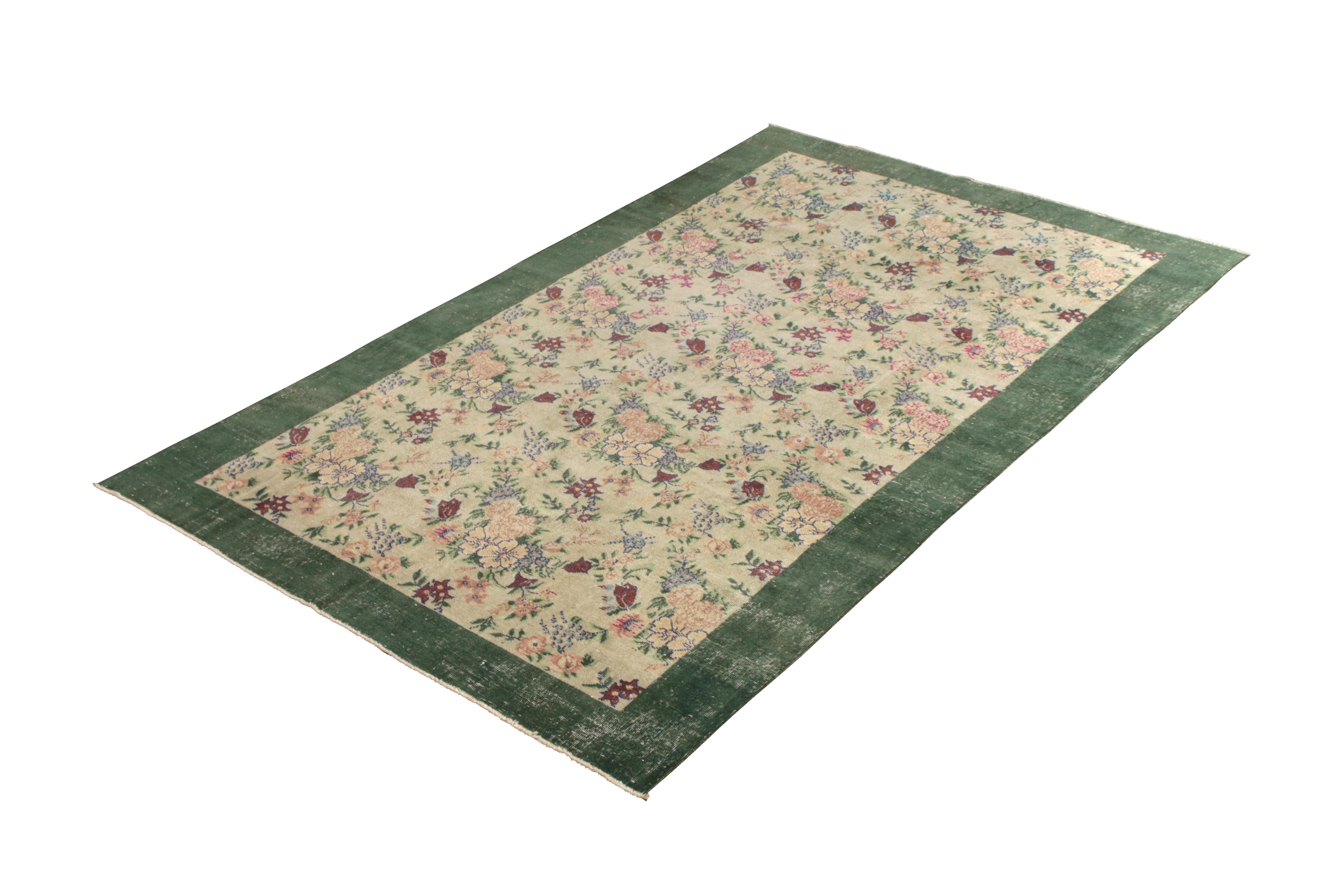 Hand knotted in wool originating from Turkey circa 1960-1960, this item is a vintage rug with a mid-century sensibility suspected to remark the works of celebrated Turkish icon Zeki Müren, who favored the European sensibilities and open border like