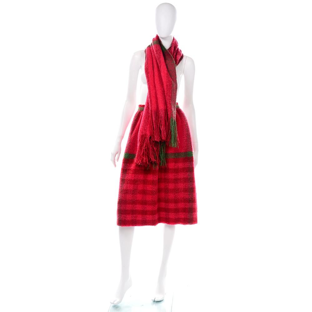 This is an incredible vintage skirt and matching scarf in a fuzzy red mohair or mohair blend red and green plaid fabric.  The skirt has a fixed waist with a button for closure and is fully lined. The beautiful shawl or scarf has long fringe on the