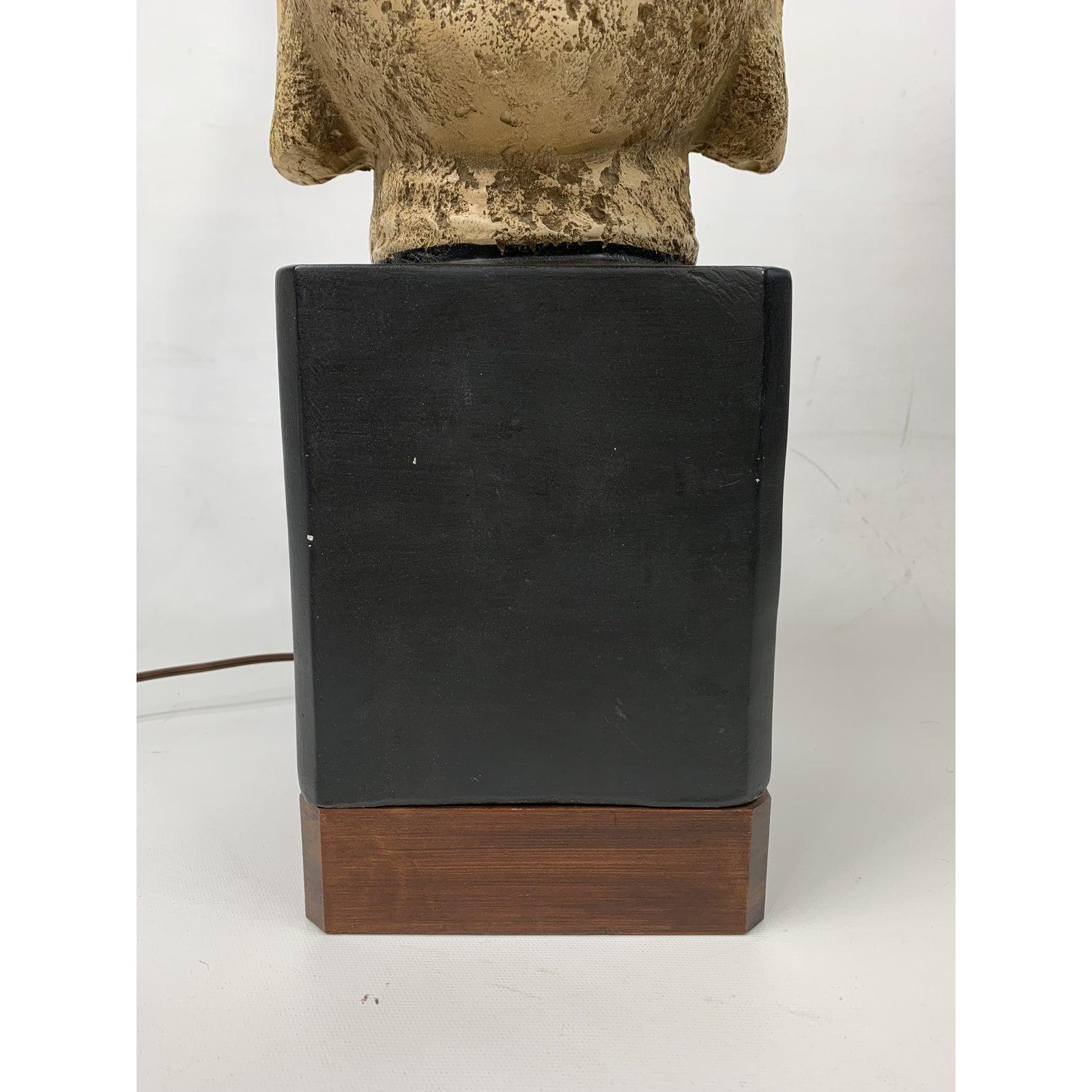 Very unique 1960s modern Buddha pottery bust table lamp, this is a very nice large lamp and the base is made out of teak.