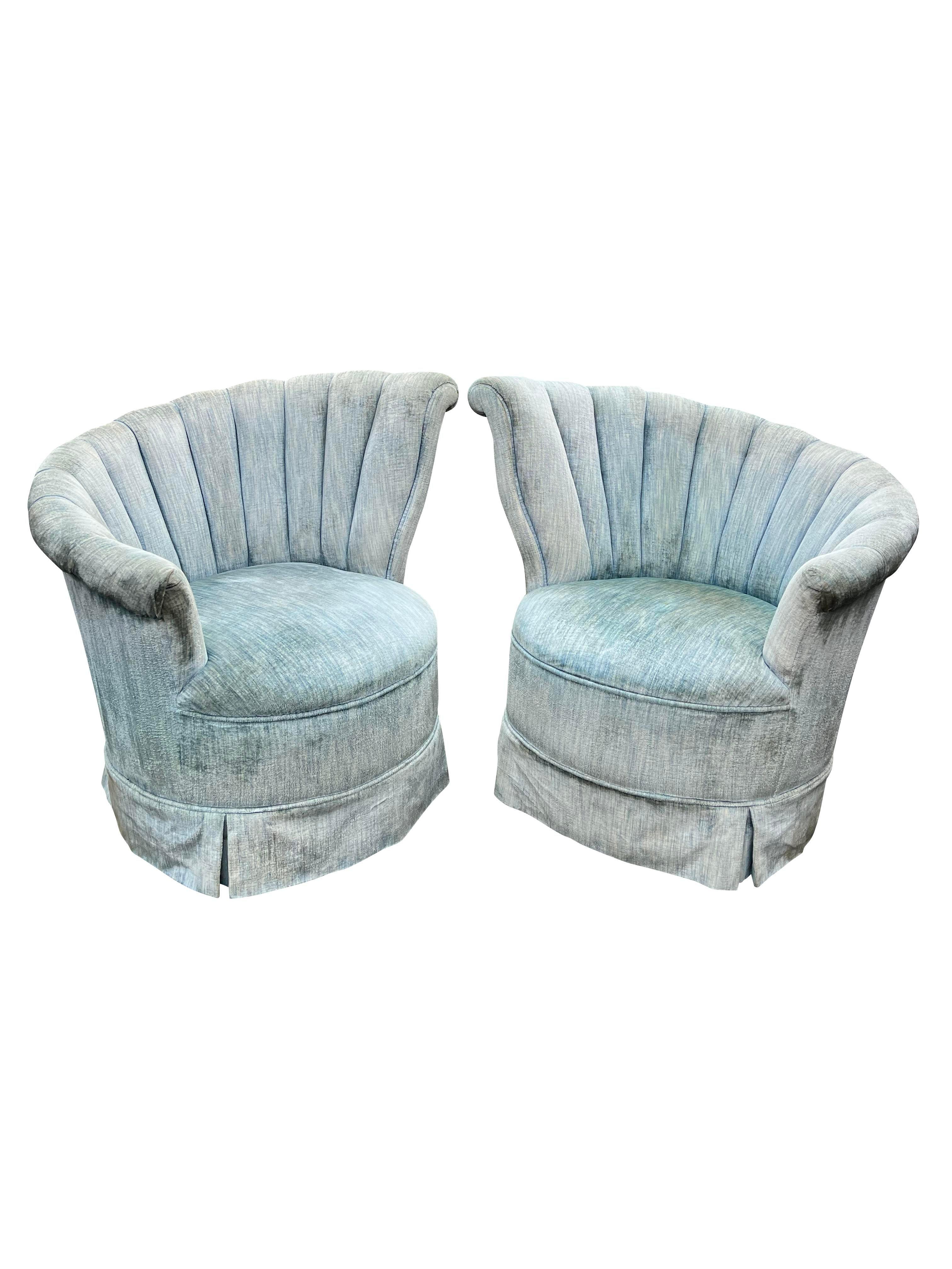 Vintage Modern Fan Back Wing Skirted Chairs - A Pair

Indulge in vintage luxury with this stunning pair of vintage modern fan back wing skirted chairs. Upholstered in a soft, powder blue velour, these chairs offer both comfort and style.

Key