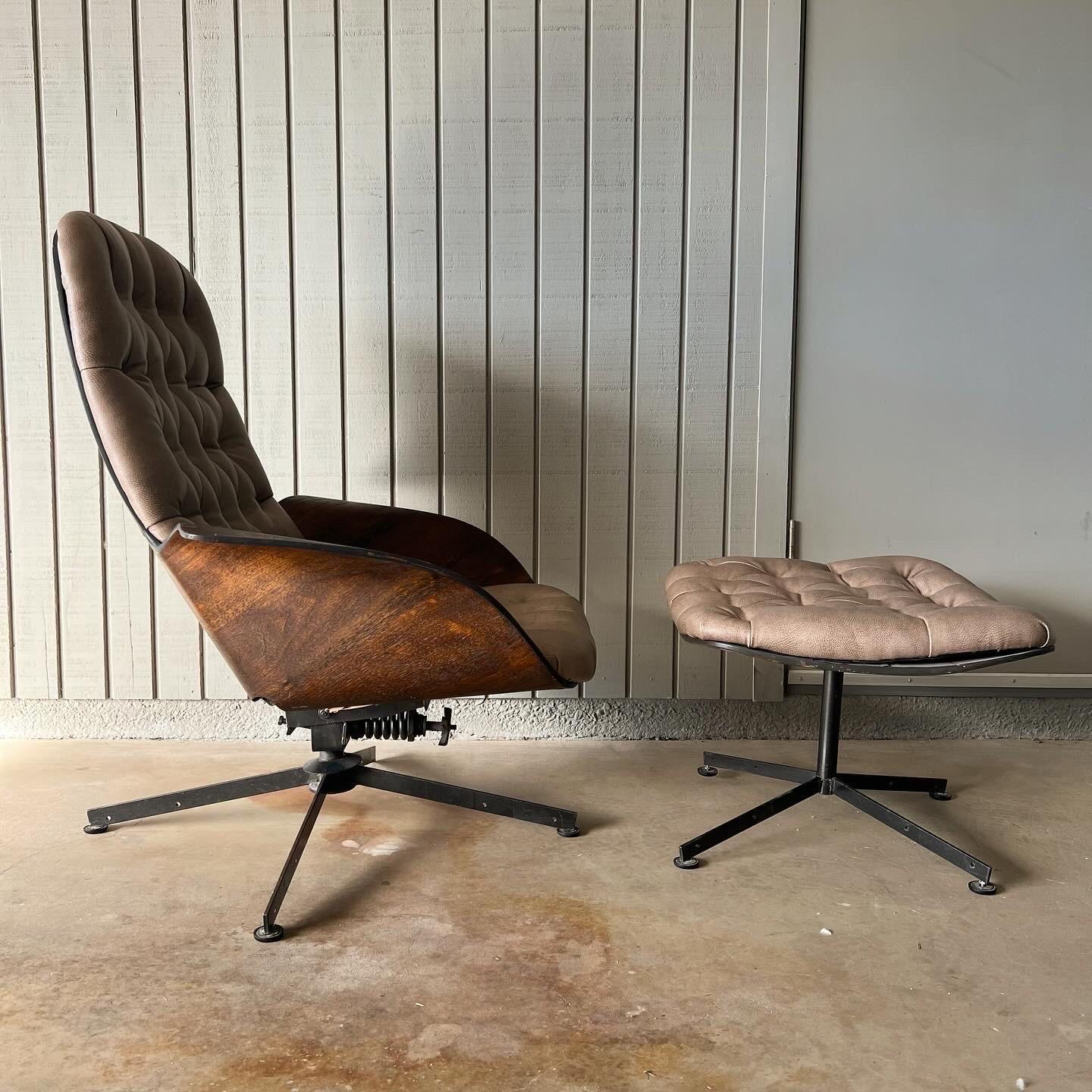 1960s vintage Mr. Chair and ottoman by George Mulhauser for Plycraft. This iconic mid century modern chair features sculptural bent walnut armrests and new textured leather tufted upholstery. The chair and ottoman both swivel. The chair tilts on a