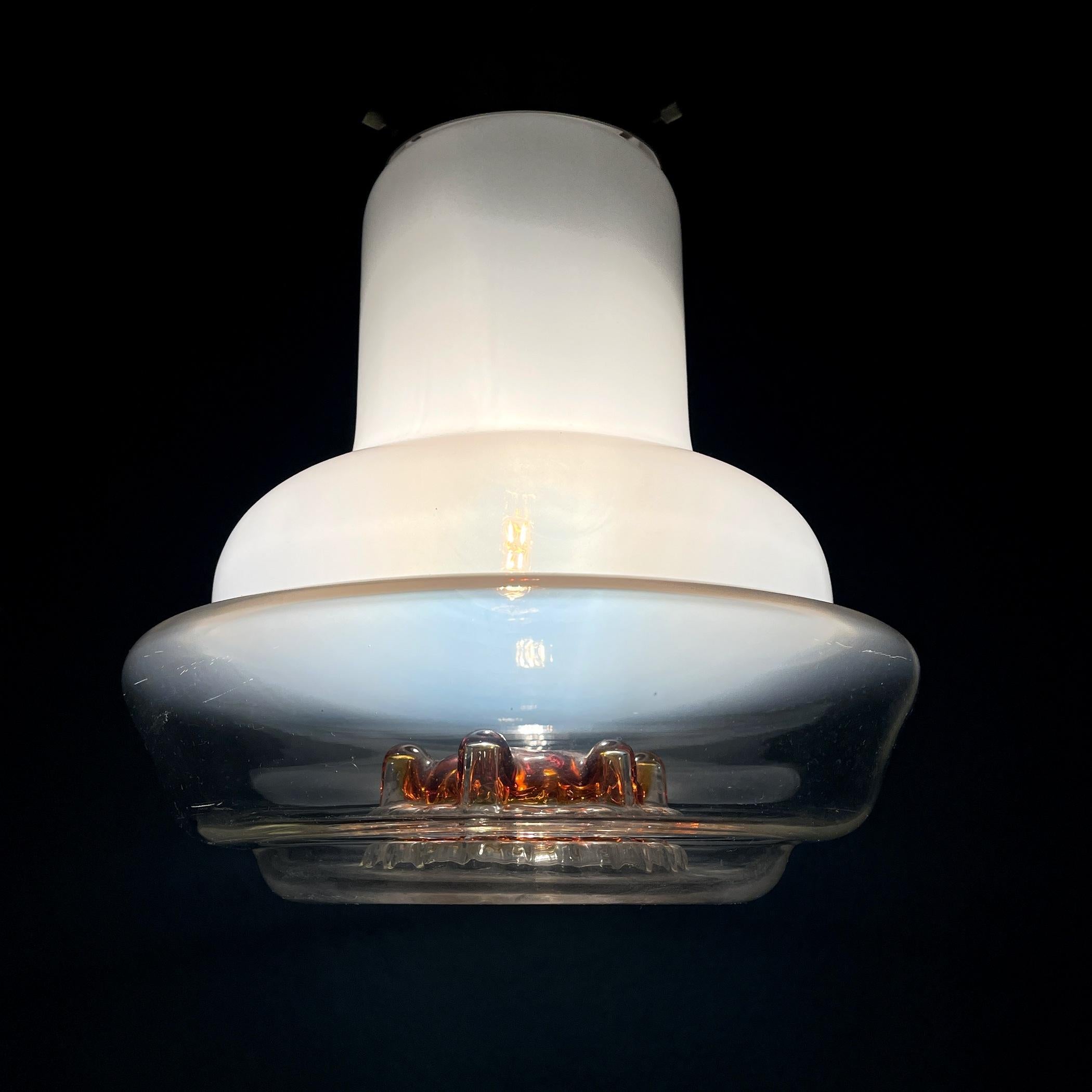 Incredibly beautiful mid-century Murano glass pendant lamp from Mazzega. Made in Italy in the 1960s.
The beautiful, elegant shape will bring the atmosphere of 60s Italy into your home.
Very good vintage condition, no chips or cracks. Completely