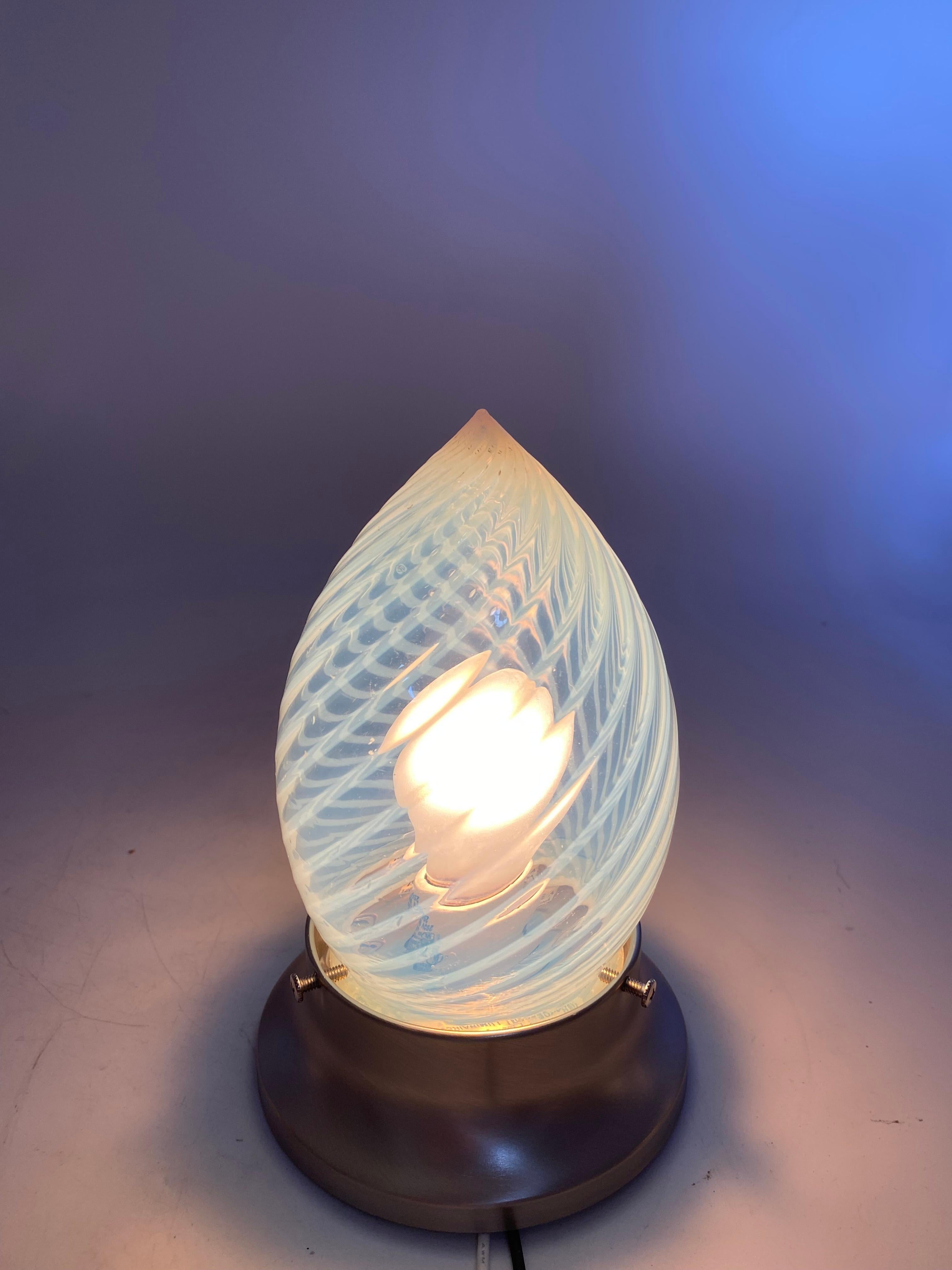 Vintage Art Deco vaseline opalescent teardrop swirl glass bullet shade. Heavy glass with a translucent green hue with masterfully perfectly done hand-blown swirls, circa 1960s possible made in Italy or USA in the 1960s this is a wonderful addition