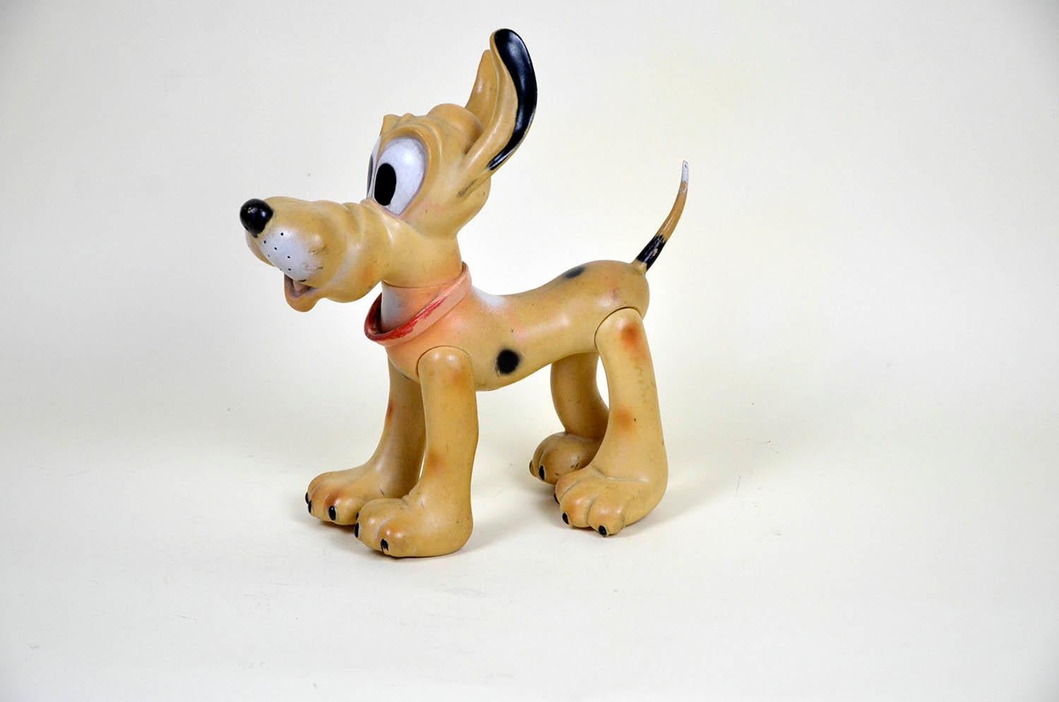 Vintage Pluto the pup squeak rubber toy made by Ledraplastic Italy in the 1960s.

All four legs and head are movable. 

Marked Walt Disney Production on the back and stamped with Ledraplastic elephant symbol.

Collector's note:

In 1962, the