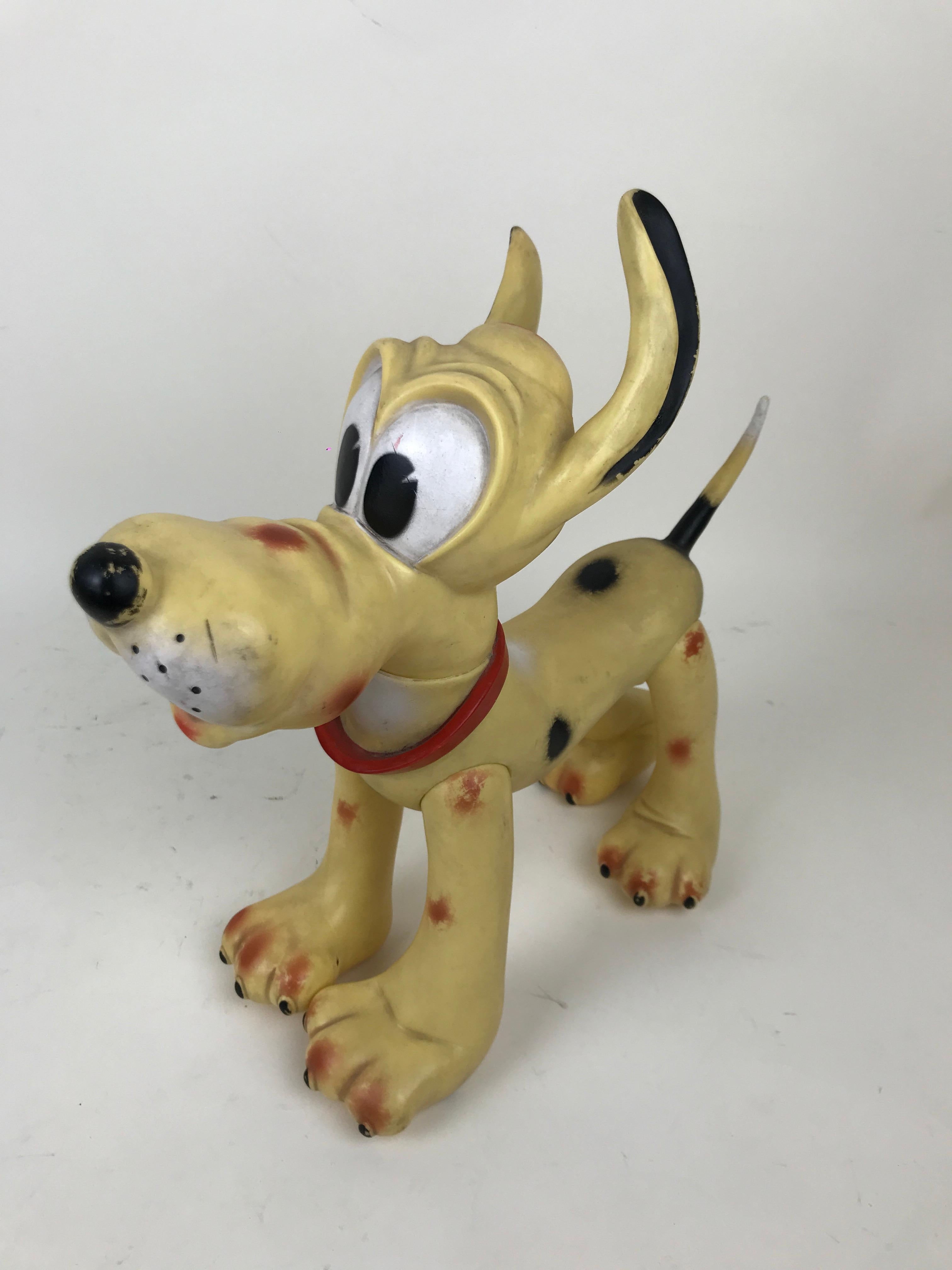 Vintage Pluto the pup squeak rubber toy made by Ledraplastic Italy in the 1960s.

All four legs and head are movable. 

Marked Walt Disney production on the back and stamped with Ledraplastic elephant symbol.

Collector's note:

In 1962, the