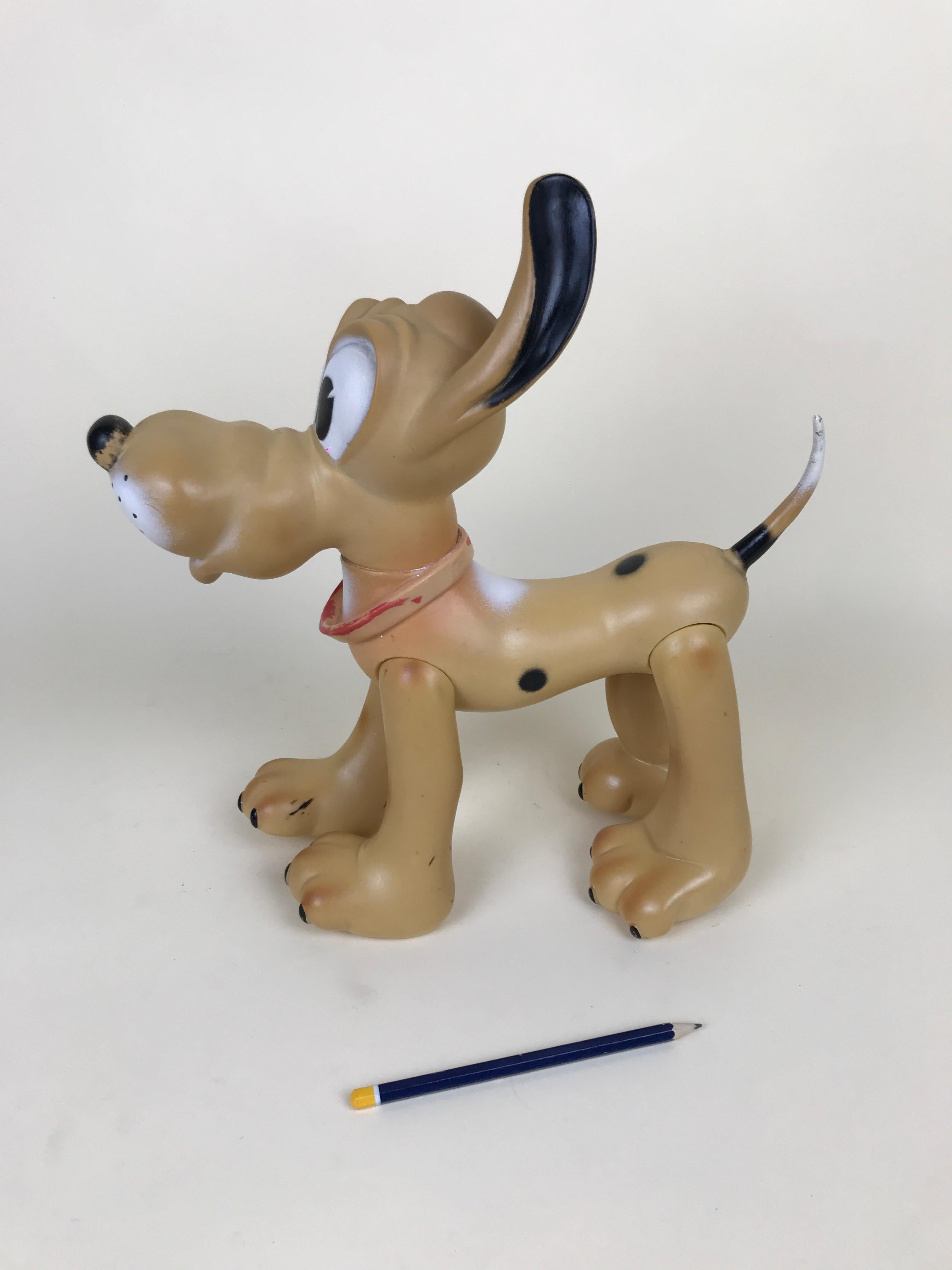 Vintage Pluto the pup squeak rubber toy made by Ledraplastic Italy in the 1960s.

All four legs and head are movable. 

Marked Walt Disney production on the back and stamped with Ledraplastic elephant symbol.

Collector's note:

In 1962, the