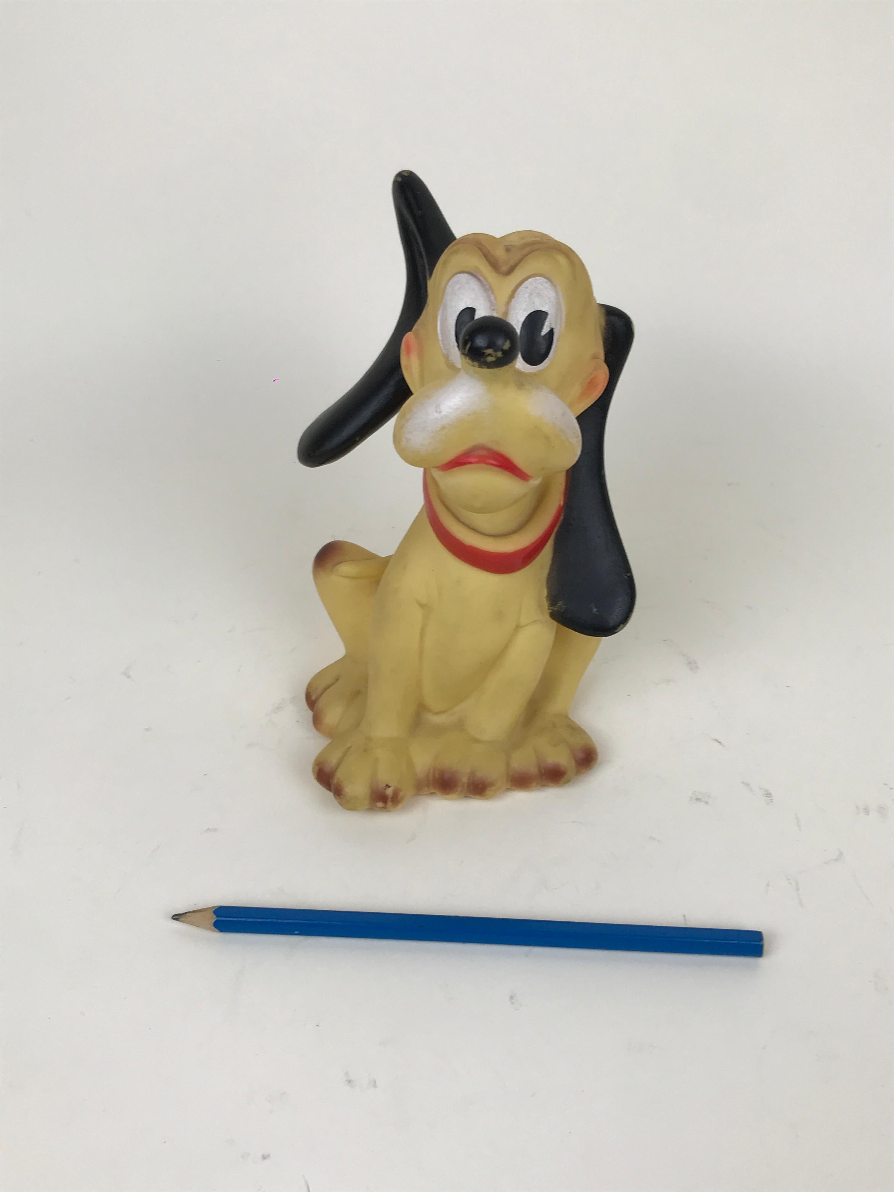 Vintage Pluto the pup squeak rubber toy made by Ledraplastic Italy in the 1960s.

This Pluto toy has a peculiar asymmetric position of the ears making it particularly collectible. 

Marked Walt Disney Production on the bottom and stamped with