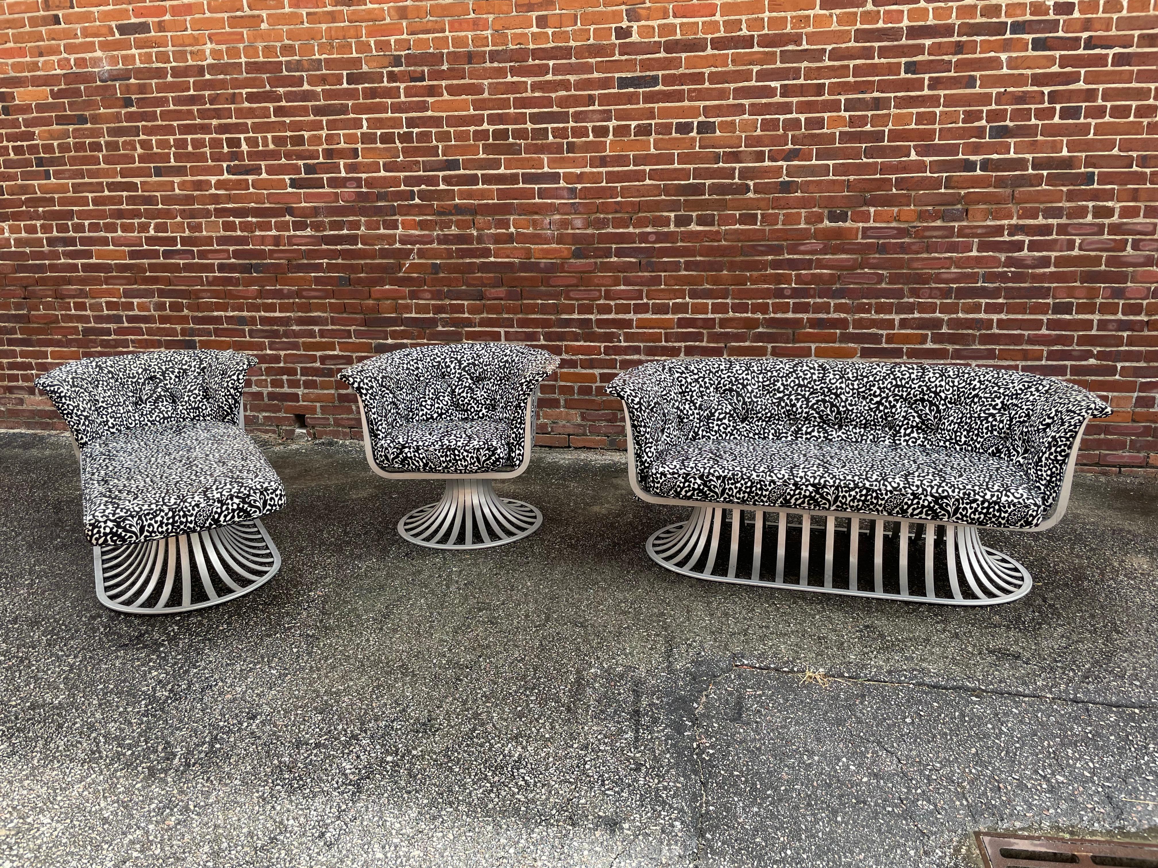 As a three piece, this Herbert Saiger for Woodard aluminum piece patio set with chaise, swivel lounge chair, and settee is in excellent condition, including its gorgeous original paisley fabric. 

Swivel chair
32” W x 30” D x 28” H x seat 19” W x