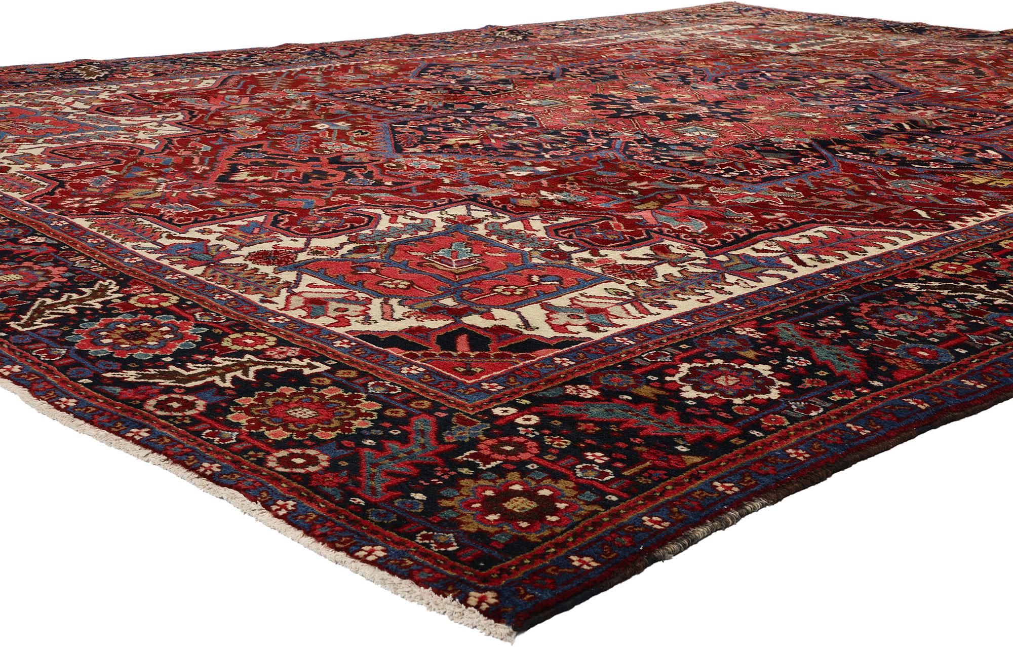 ]53880 Vintage Persian Heriz Rug, 09'05 x 12'07. Discover the distinctive allure of Heriz rugs, hailing from northwestern Iran, renowned for their unique characteristics. Handcrafted in the village of Heris, nestled on the slopes of Mount Sabalan,